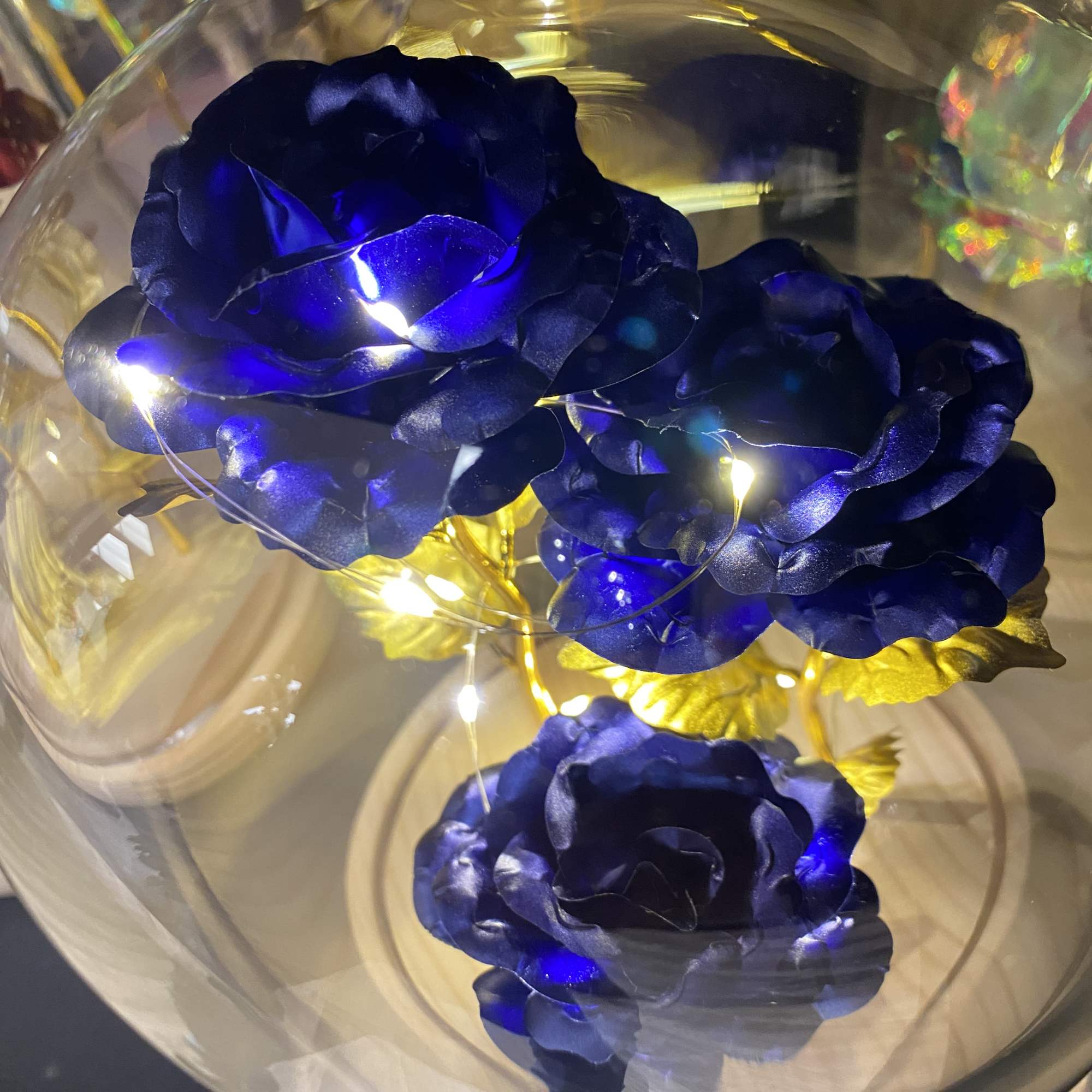 Beautiful artificial roses that are wrapped around LED lights in your choice