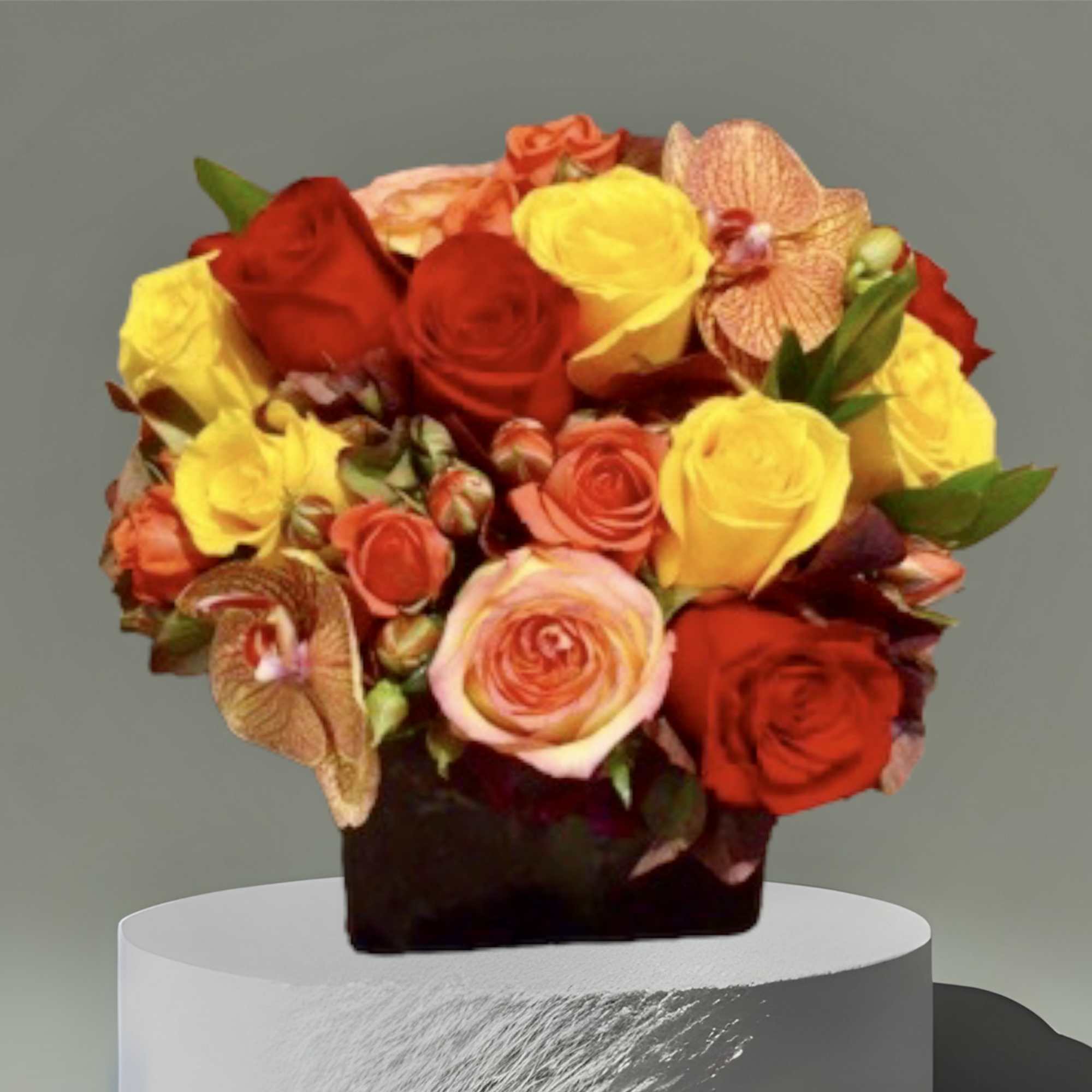 A colorful Fall mix of roses, hydrangea, and orchids. Arranged in a