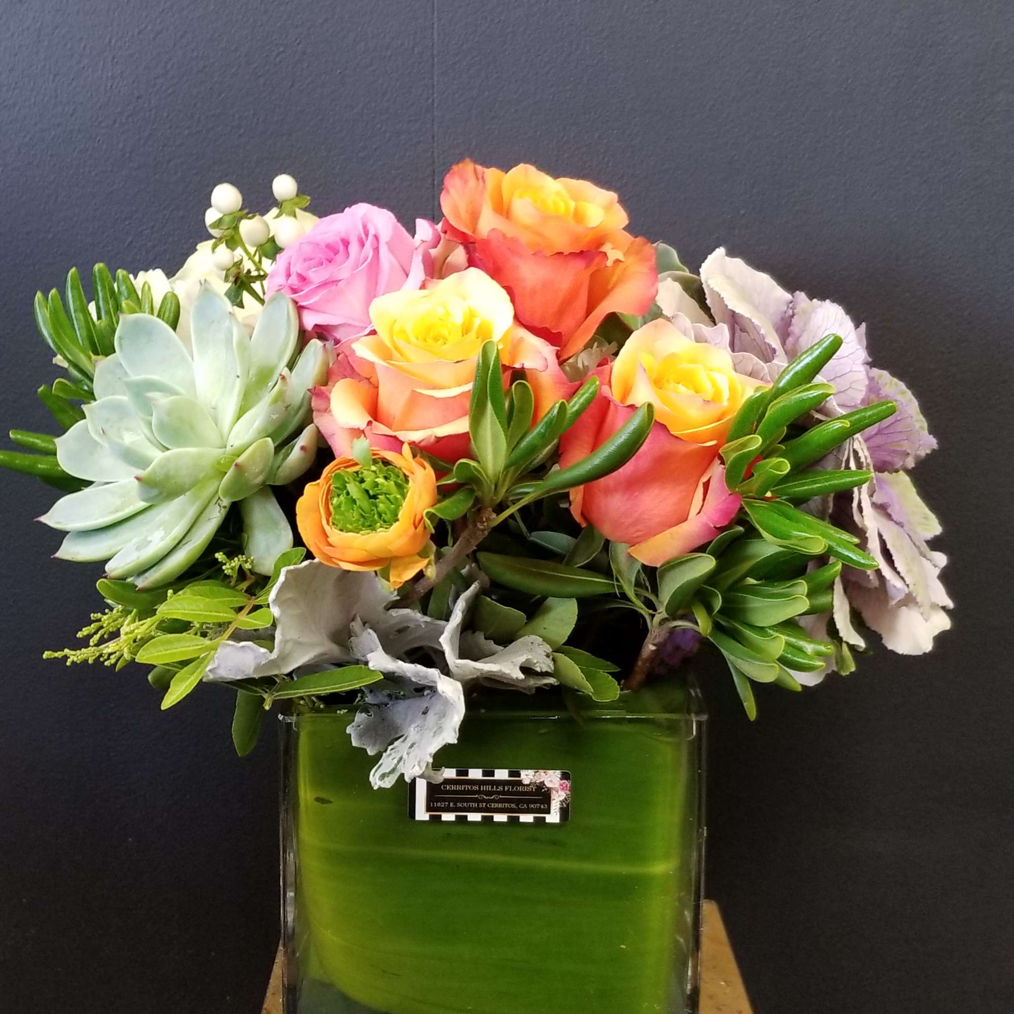 Assorted color of Rose arrangement with succulents in a cube vase