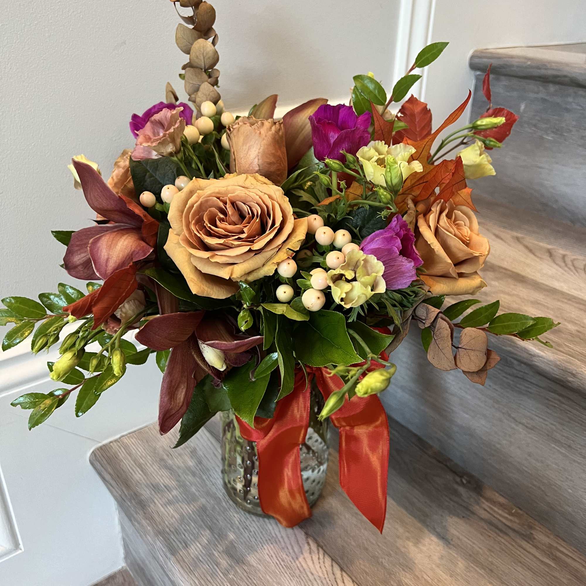 Arrangement in browns, burgundies and hot pinks
