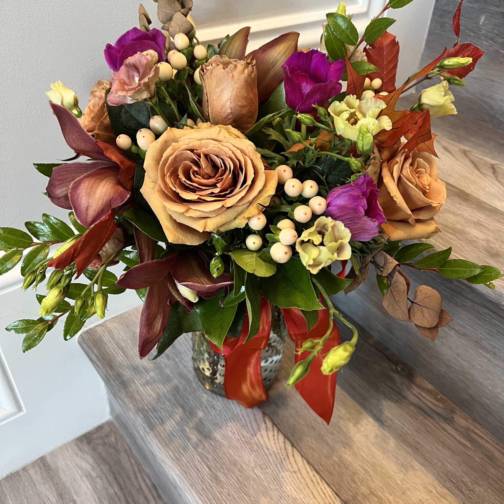 Arrangement in browns, burgundies and hot pinks
