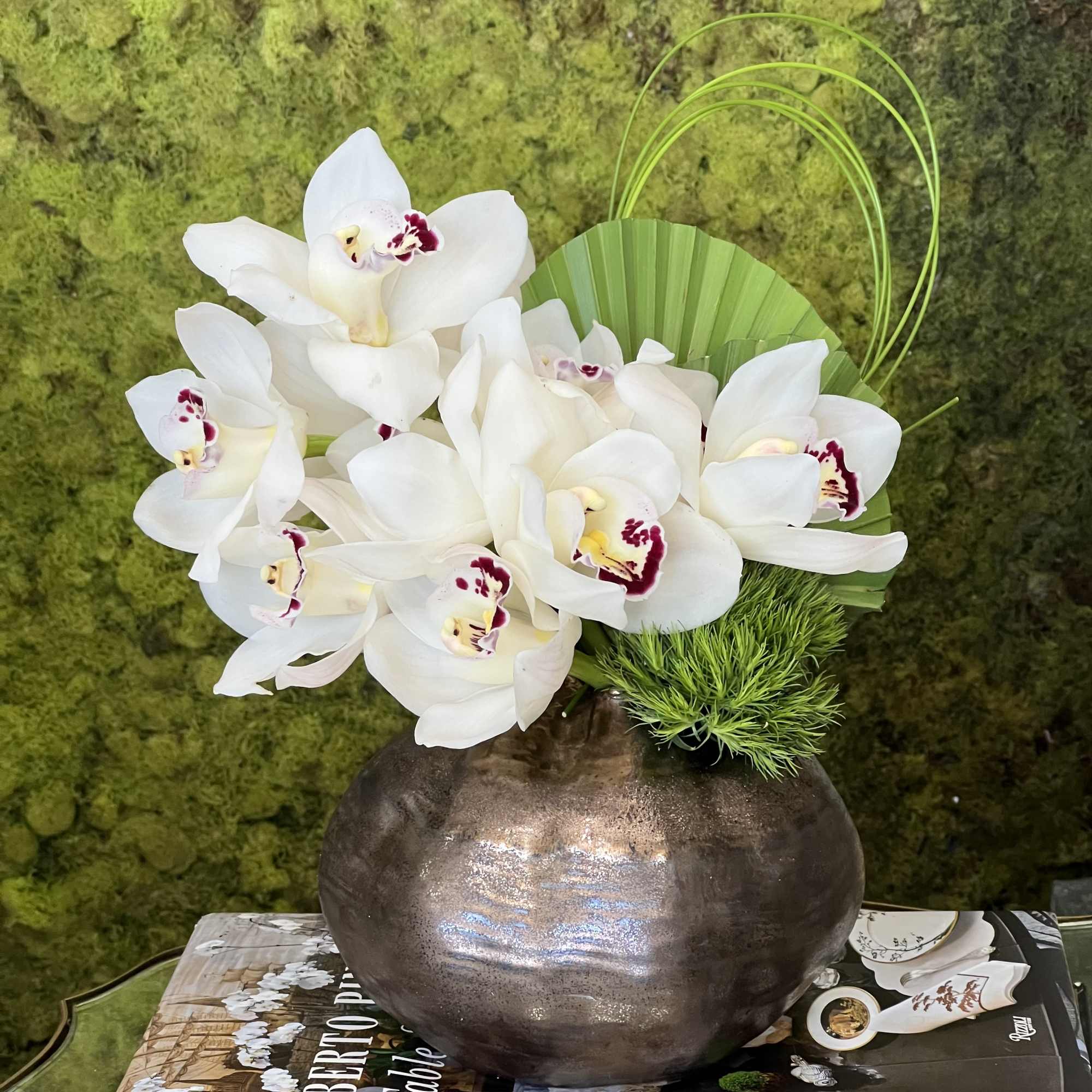 white cimbidium orchids perfect for desk 