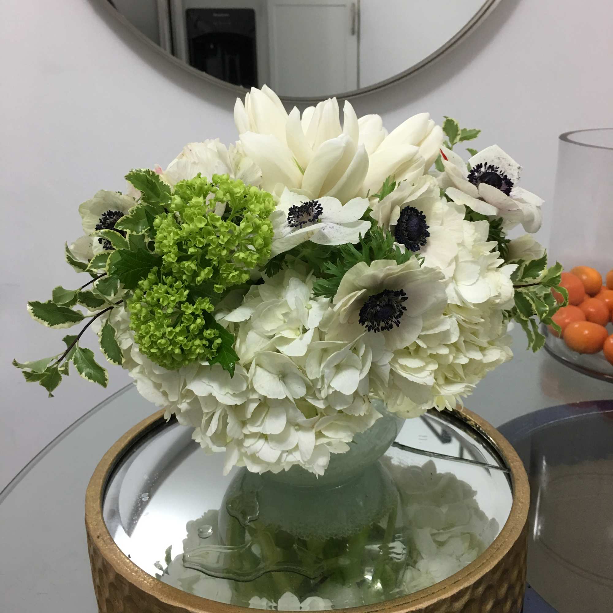 An adorable and quaint arrangement of white tulips and anemones...a perfect way