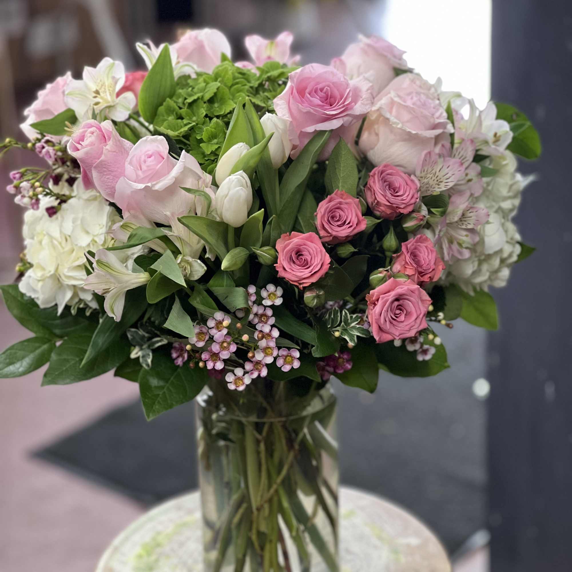 Beautiful pink and white mixture. Flower arrangement in a cylindrical container. Perfect