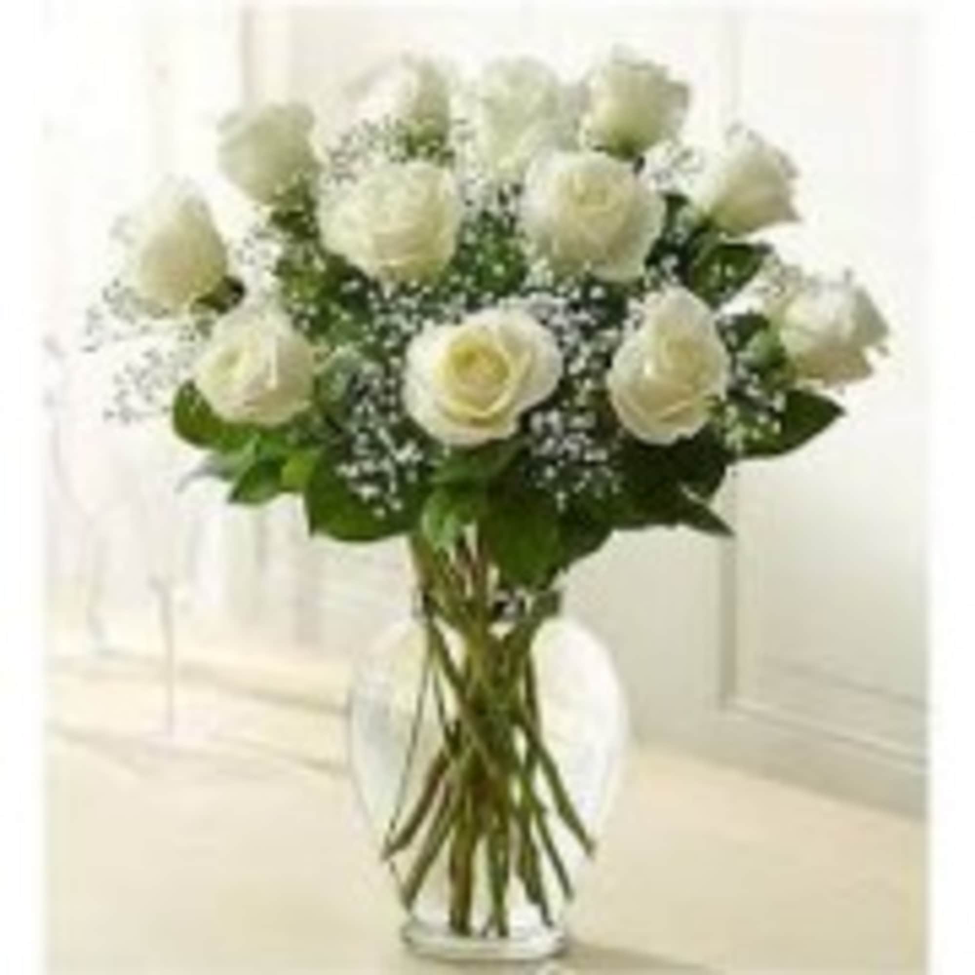 one Dozen Beautifully arranged roses with fillers and Greens. Comes in a