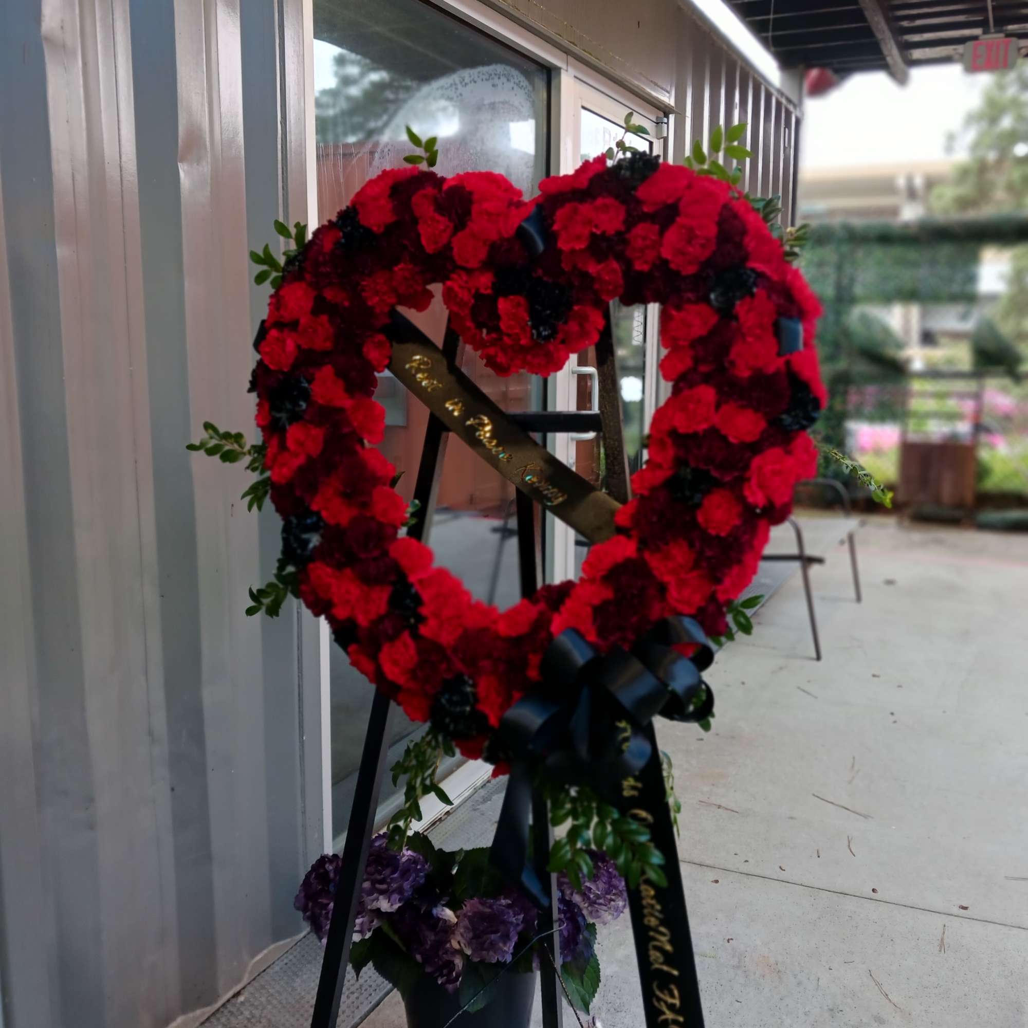 An open heart wreath with white carnations, Mums, and roses.
Color can be An open heart wreath with white carnations, Mums, and roses.
Color can be
