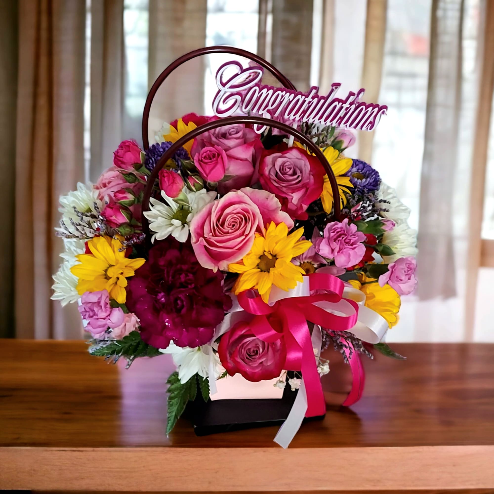 A flower box filled with an assortment of colorful flowers such as