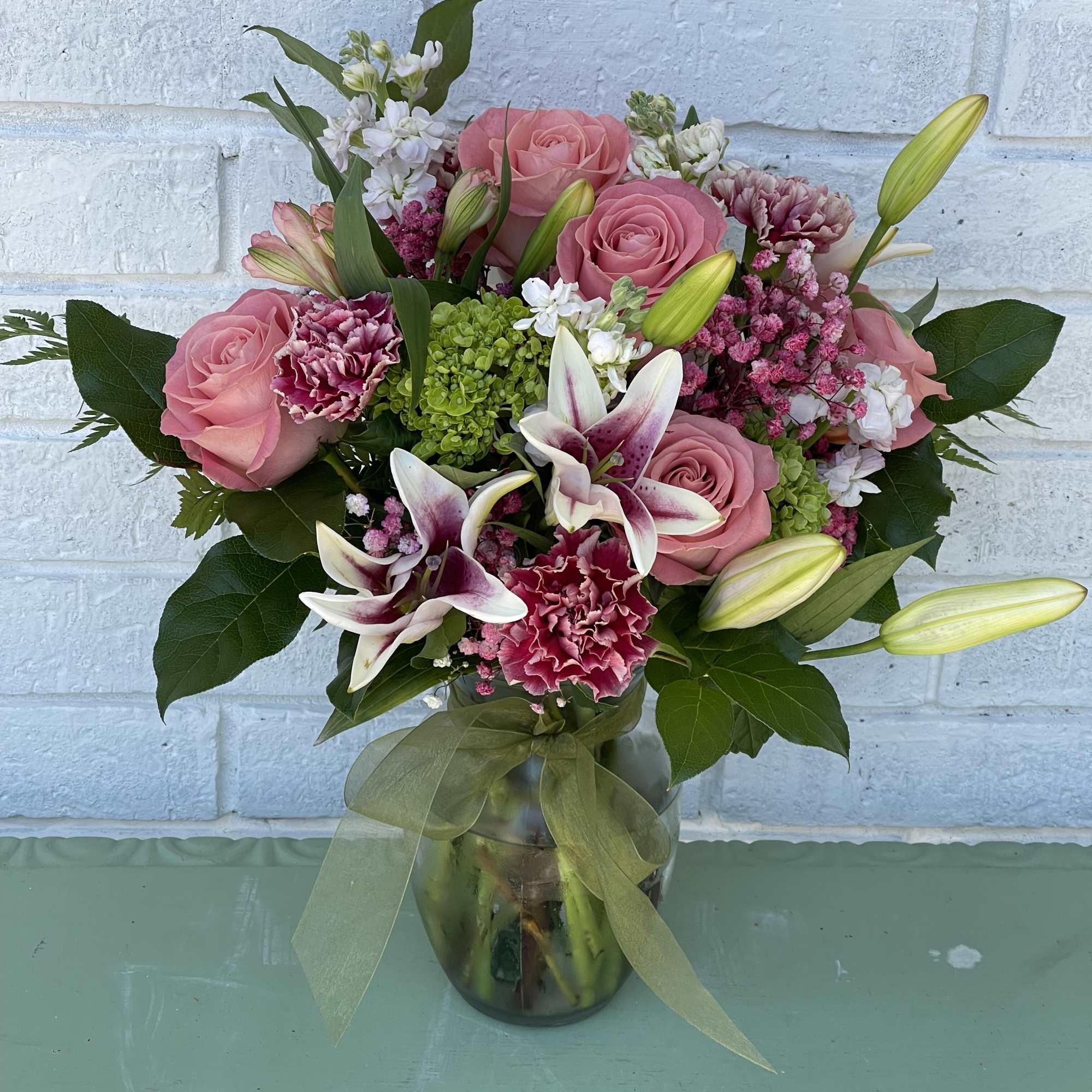 The rose and lily ginger vase floral by Jardin D'eden Florist
