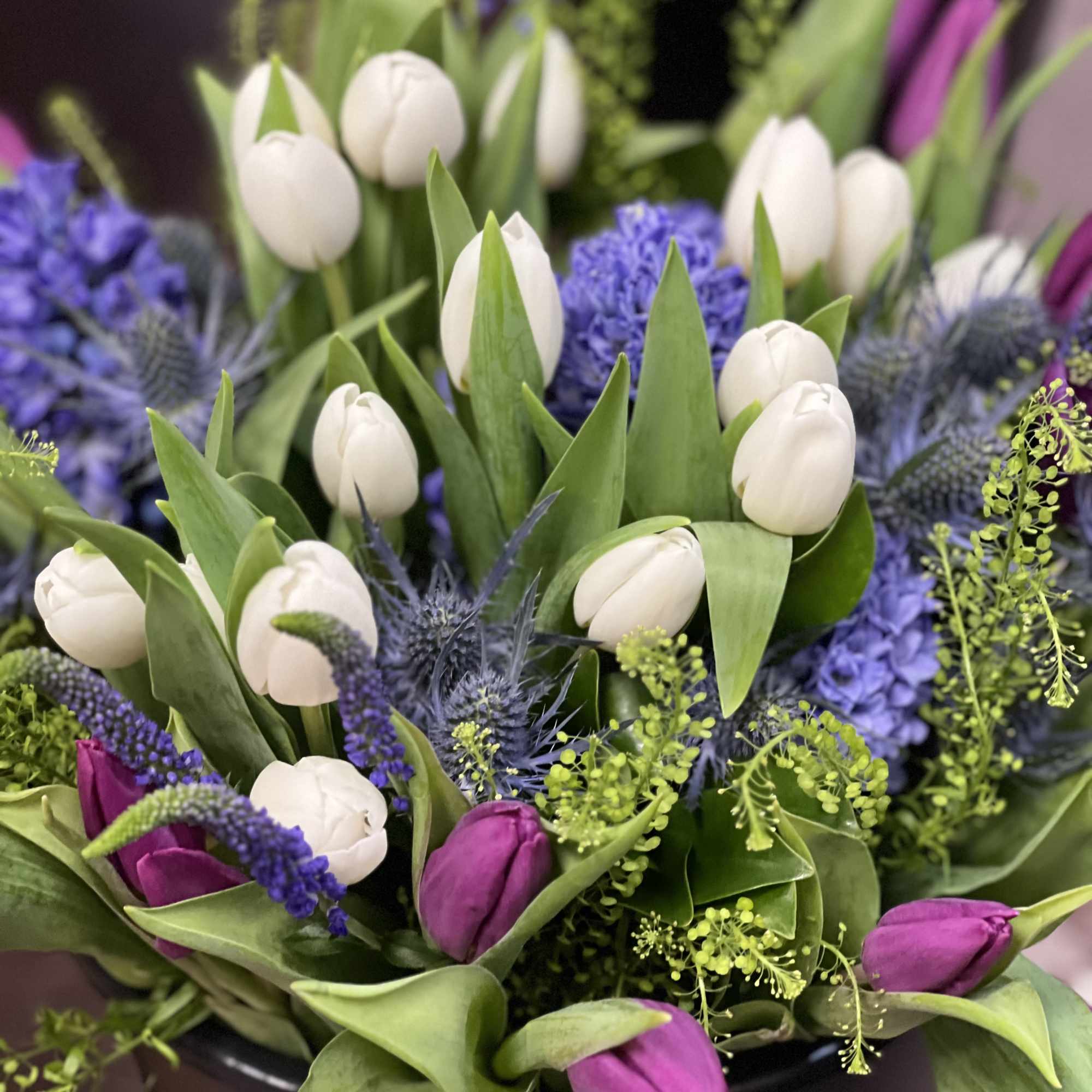 Mixture of a spring, tulips and supporting filler flowers wrapped bouquet 
Please