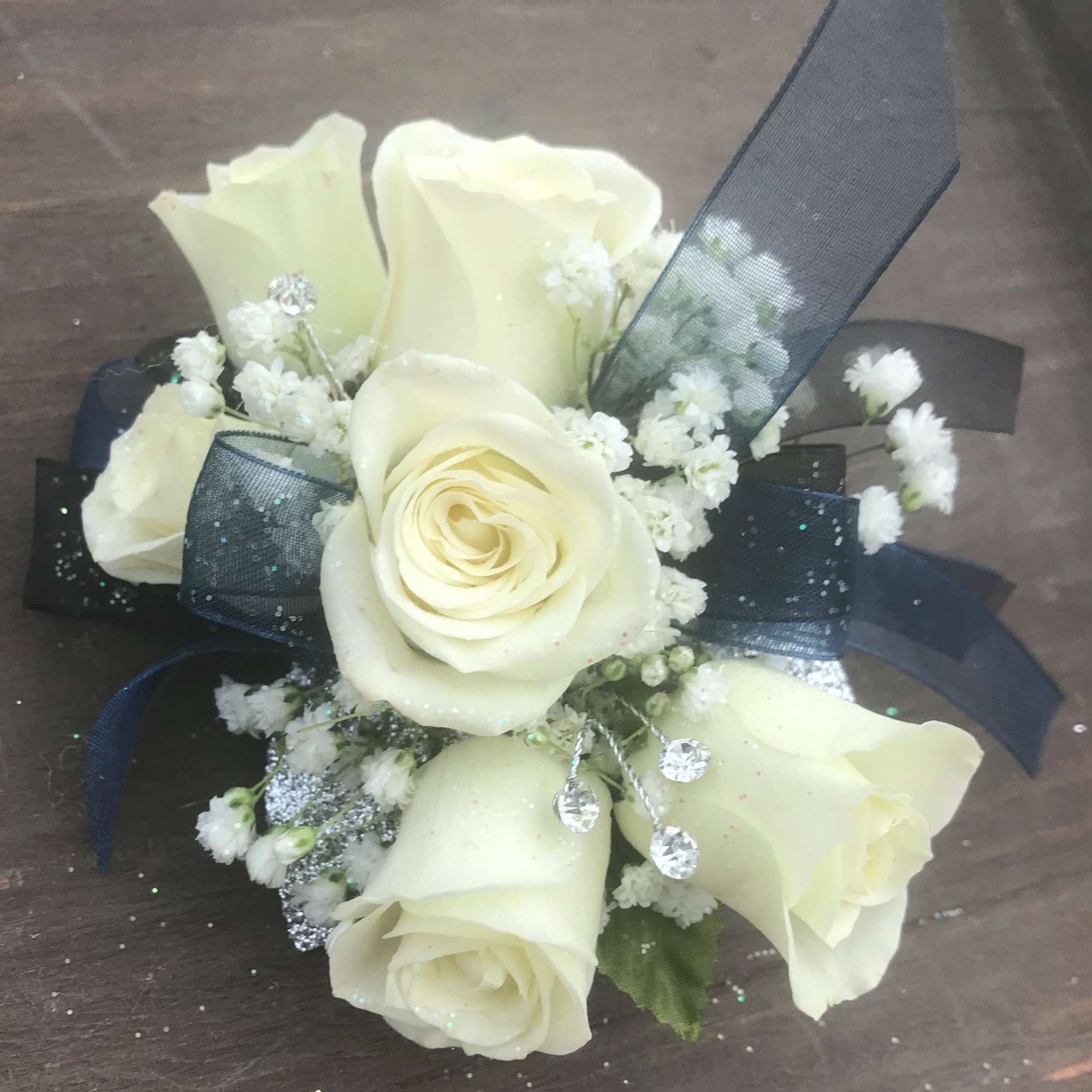 White Spray Roses, babies breath & rhinestone spray with your choice of White Spray Roses, babies breath & rhinestone spray with your choice of
