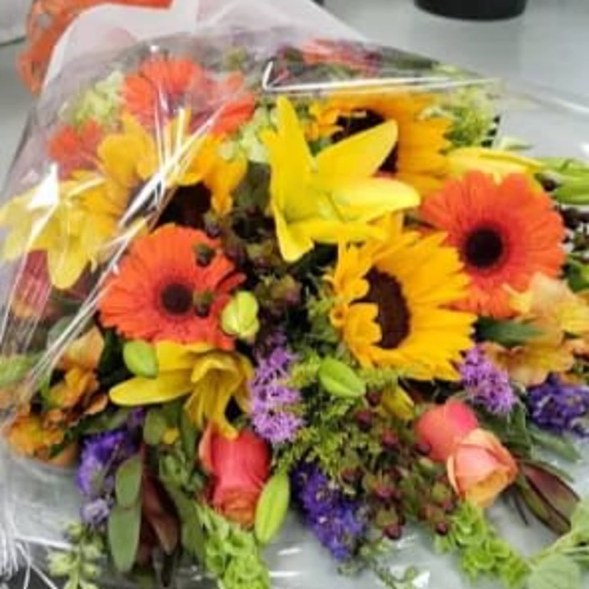 A LARGE MIXED PREMIUM ARM BOUQUET OF FRESH FLOWERS IN A FALL