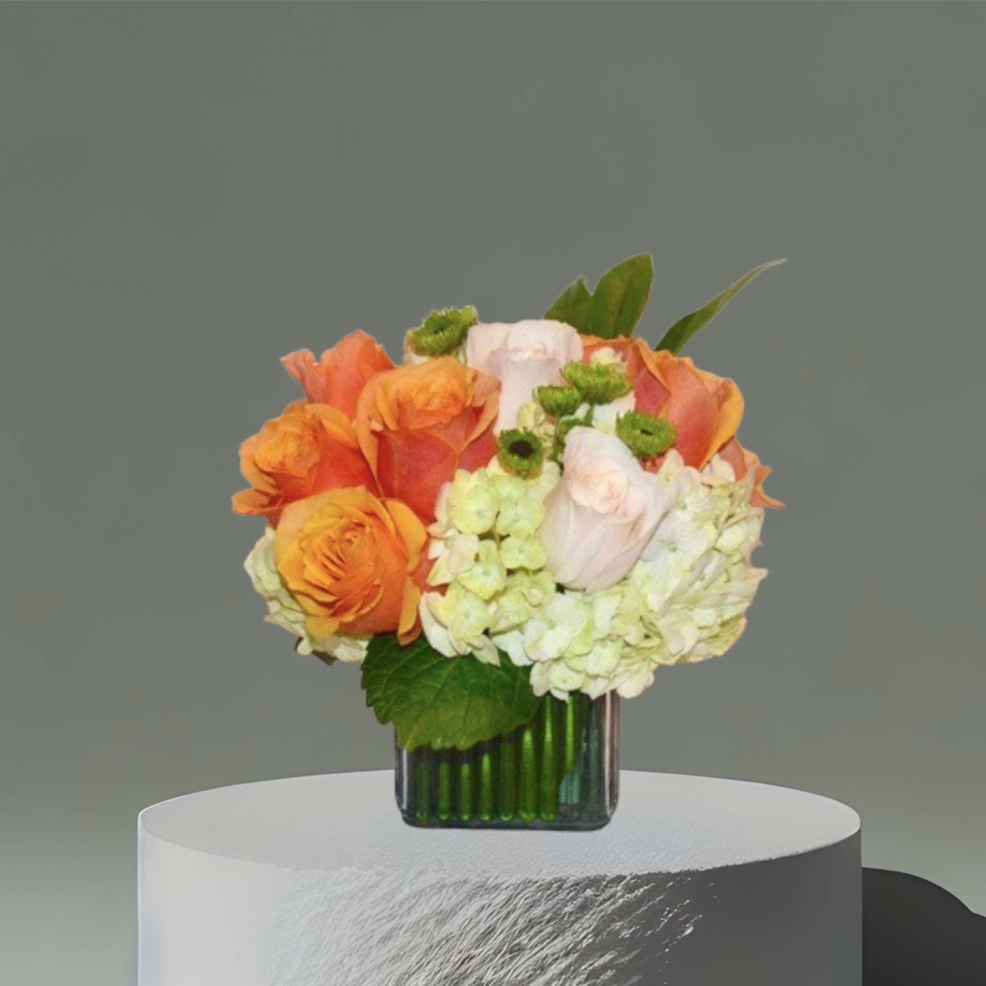 Greens and hydrangea with citrus colored roses and green button mums. Perfect