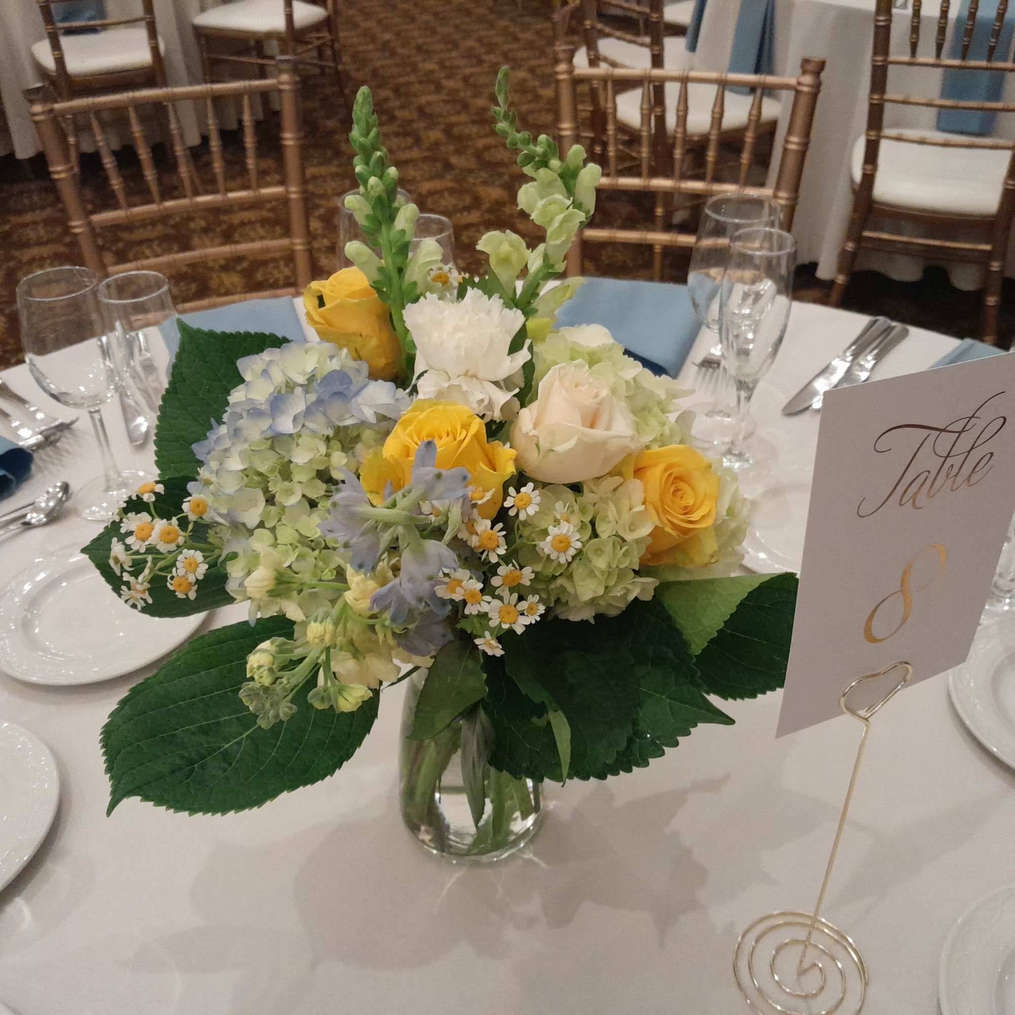Country fresh Angelica centerpiece of blue and white hydrangea, yellow roses, light