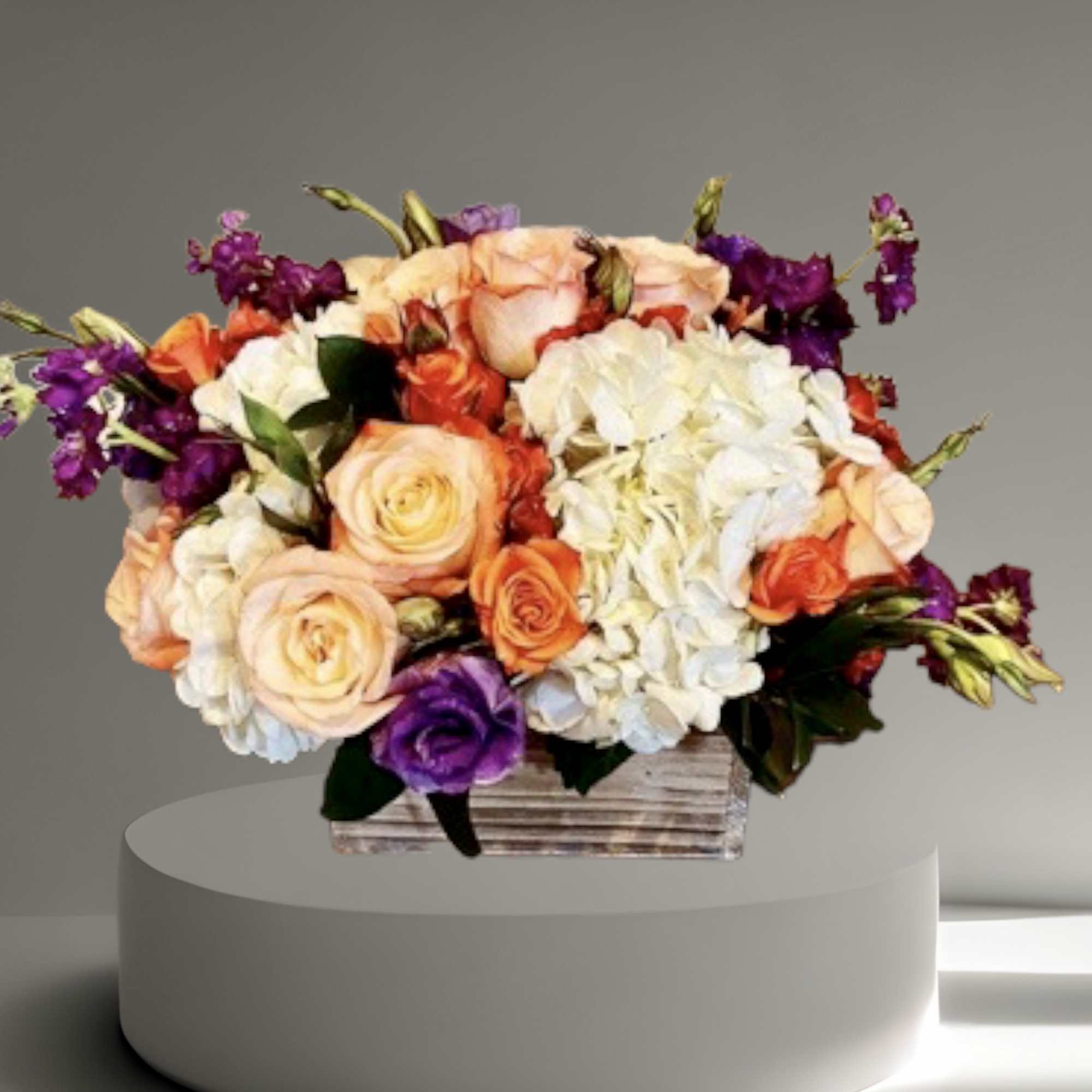 A lovely seasonal mix of roses, hydrangea, and other seasonal flowers and