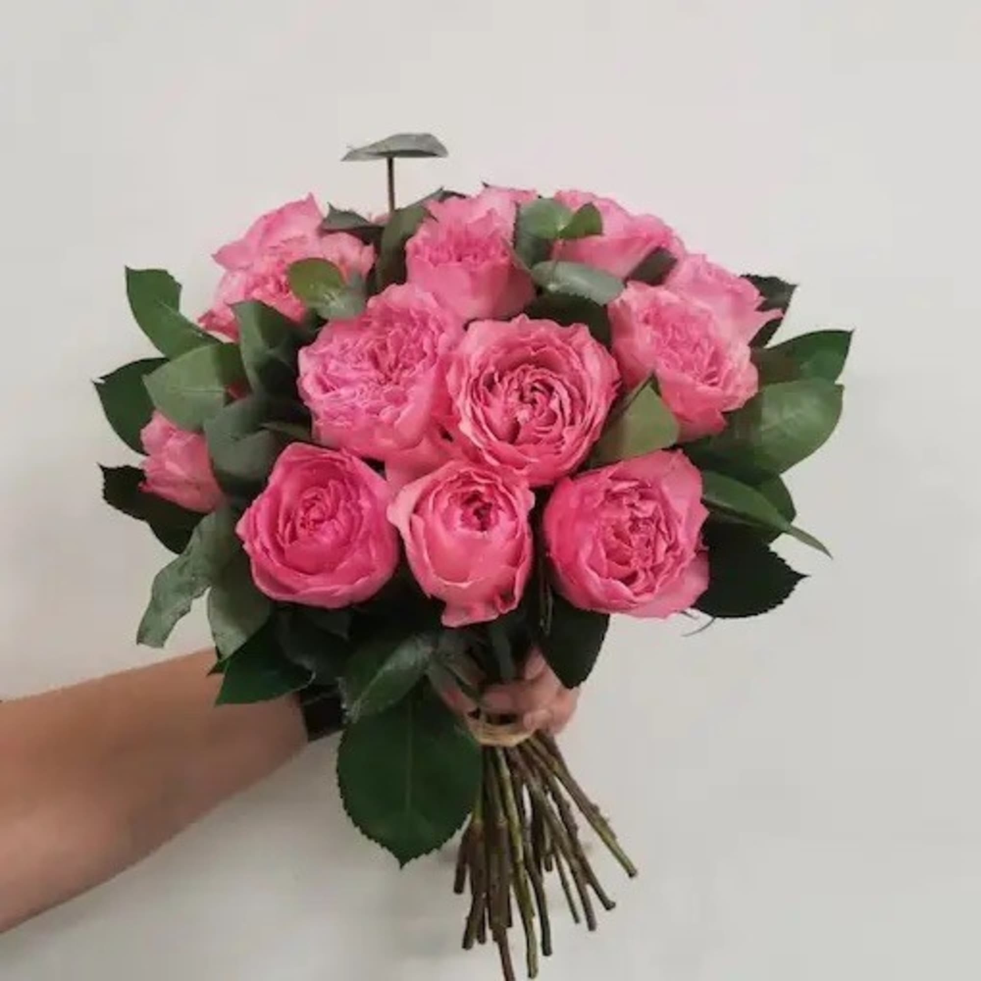This floral gift includes a beautiful selection of hand-tied red roses and