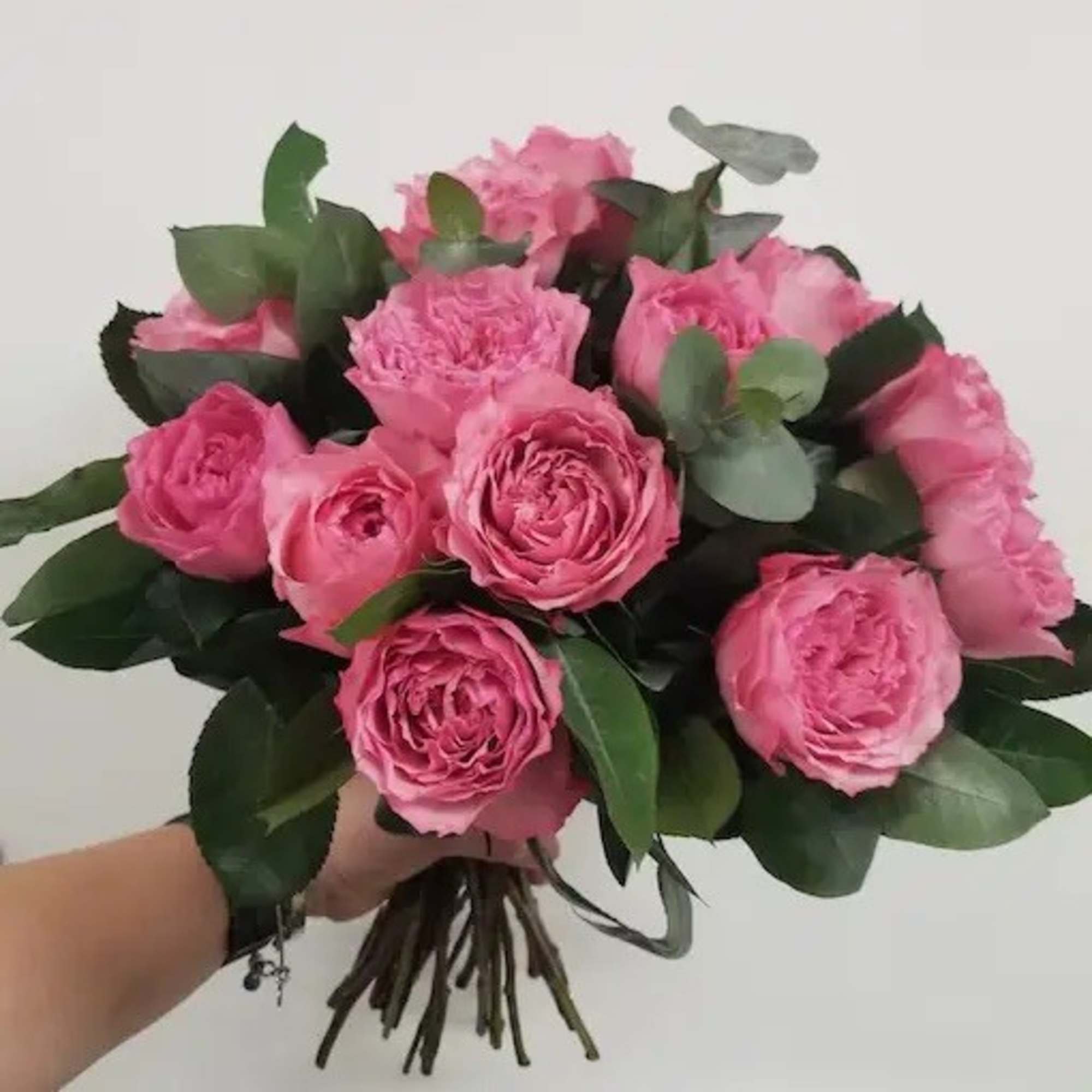This floral gift includes a beautiful selection of hand-tied red roses and