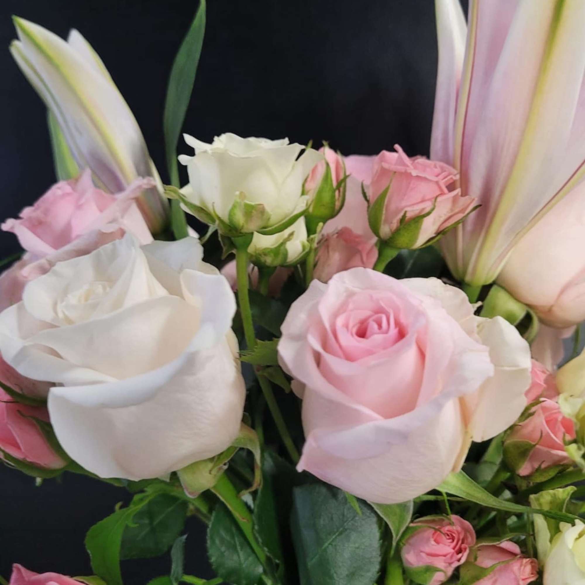 The mixed flower bouquet features a selection in classy and subtle hues.