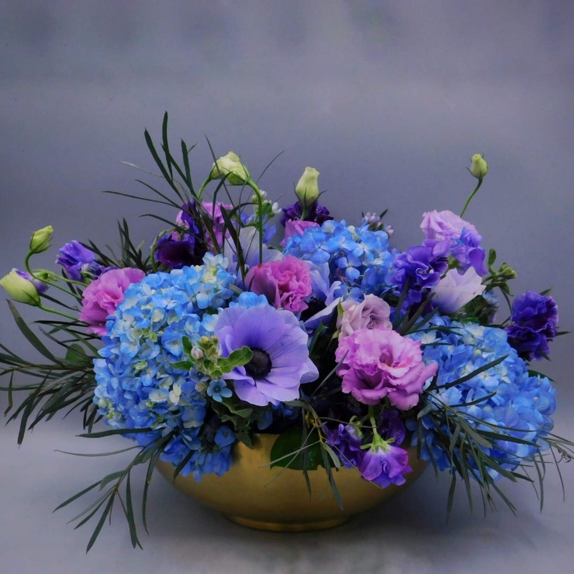 This Sweet and romantic blue flowers arragemet is the perfect gift for