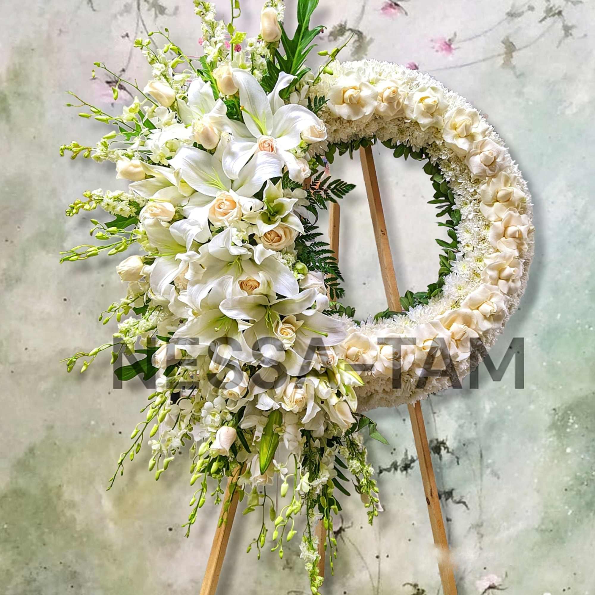 Offer a beautiful tribute with a 27&quot; round wreath of roses, hydrangeas