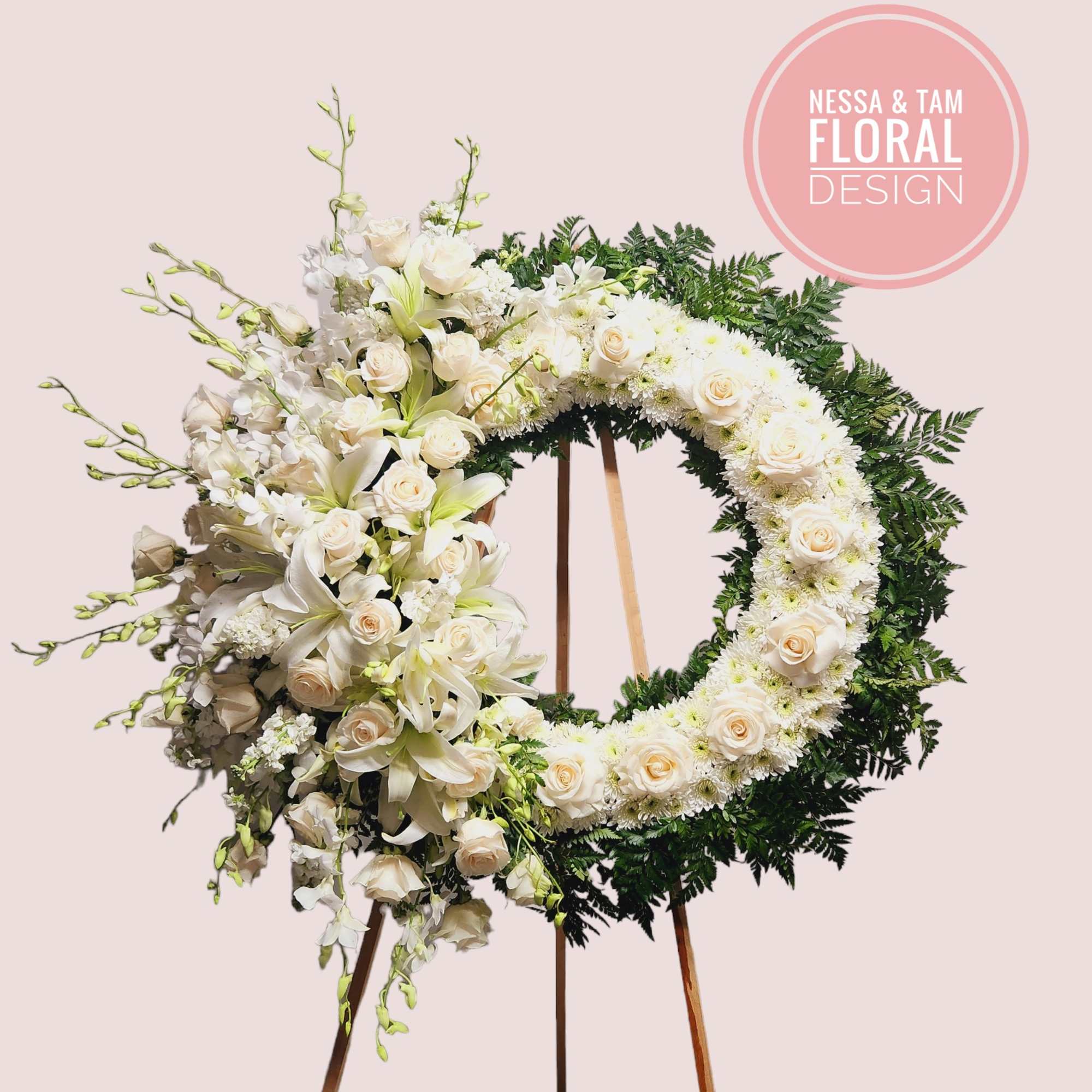 Offer a beautiful tribute with a 27&quot; round wreath of roses, hydrangeas