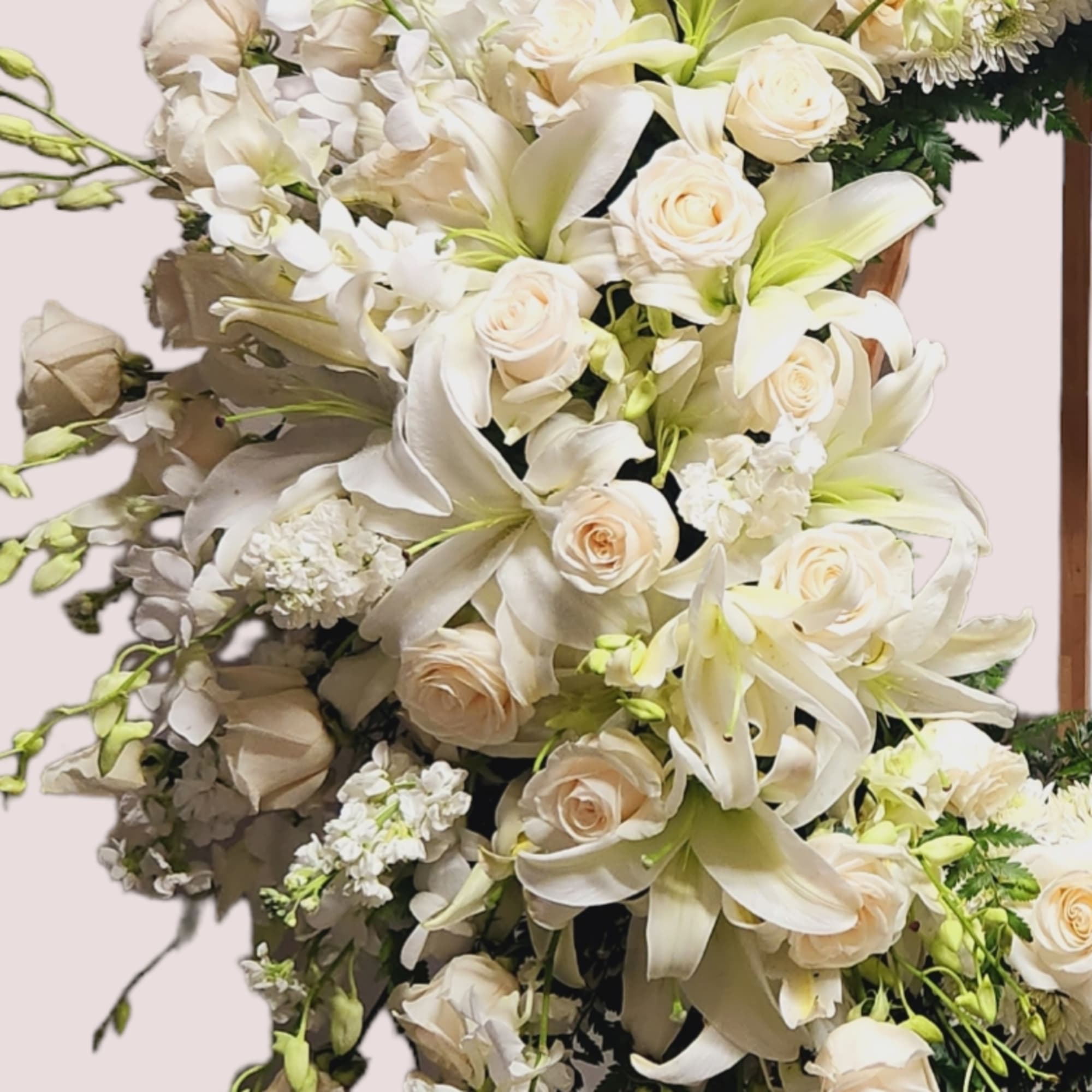 Offer a beautiful tribute with a 27&quot; round wreath of roses, hydrangeas
