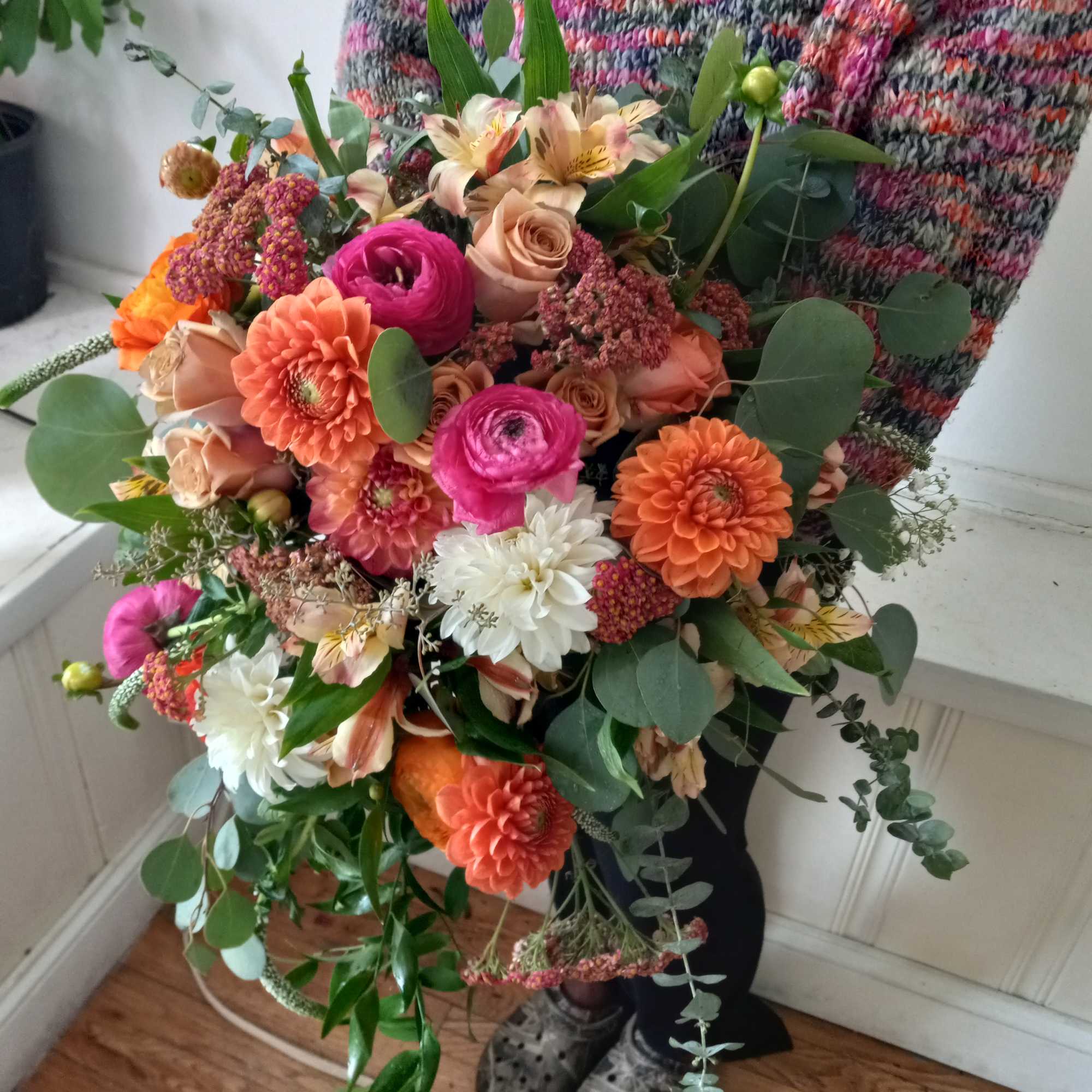 Rich and vibrant fall colors orange/terracotta dahlia, brown roses and similar color