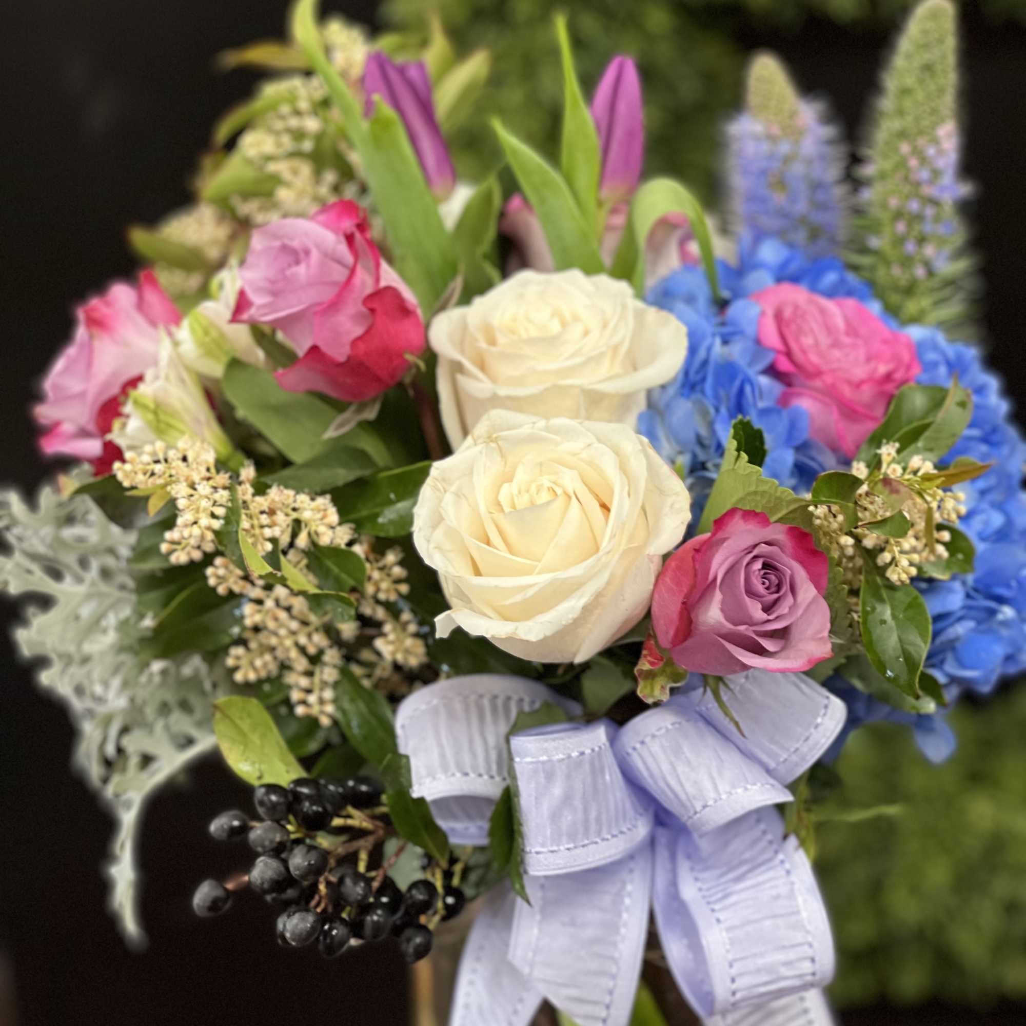 Purple lavender silver mixed bouquet in the clear vase