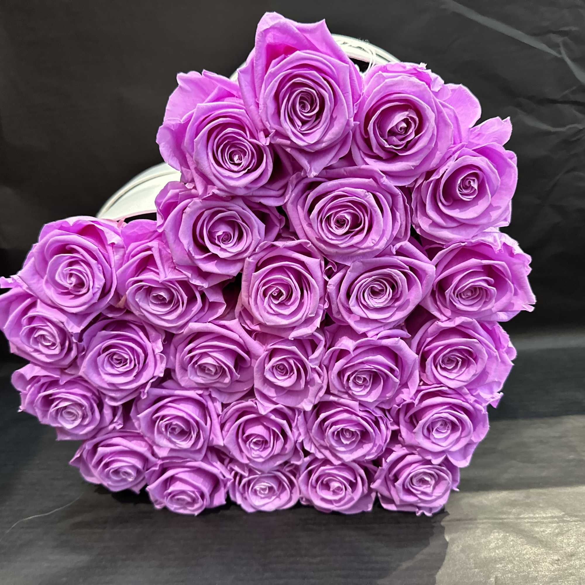 This beautiful box is adorned with different forever roses, which are preserved