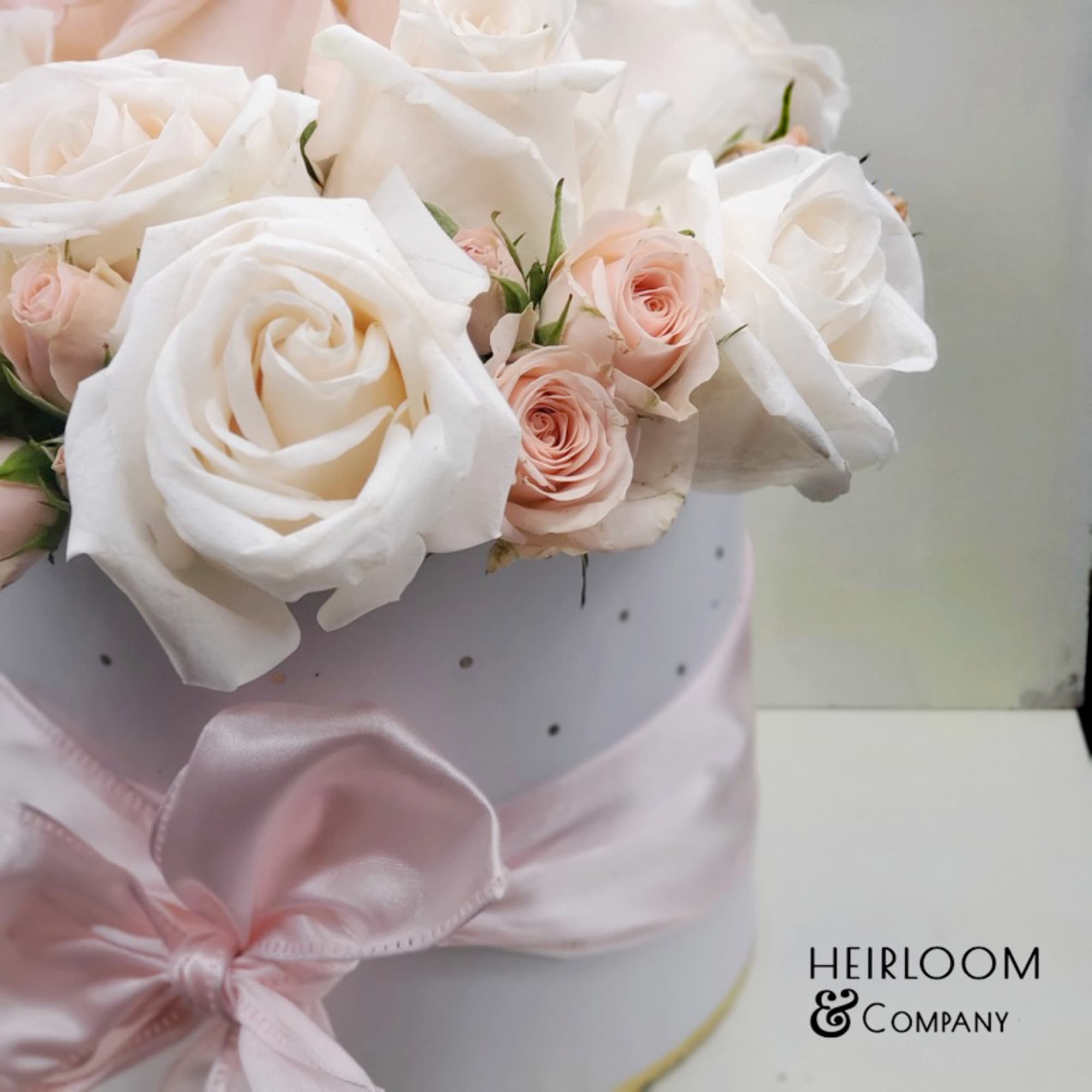 The perfect blush hatbox, filled with a variety of our prermium roses