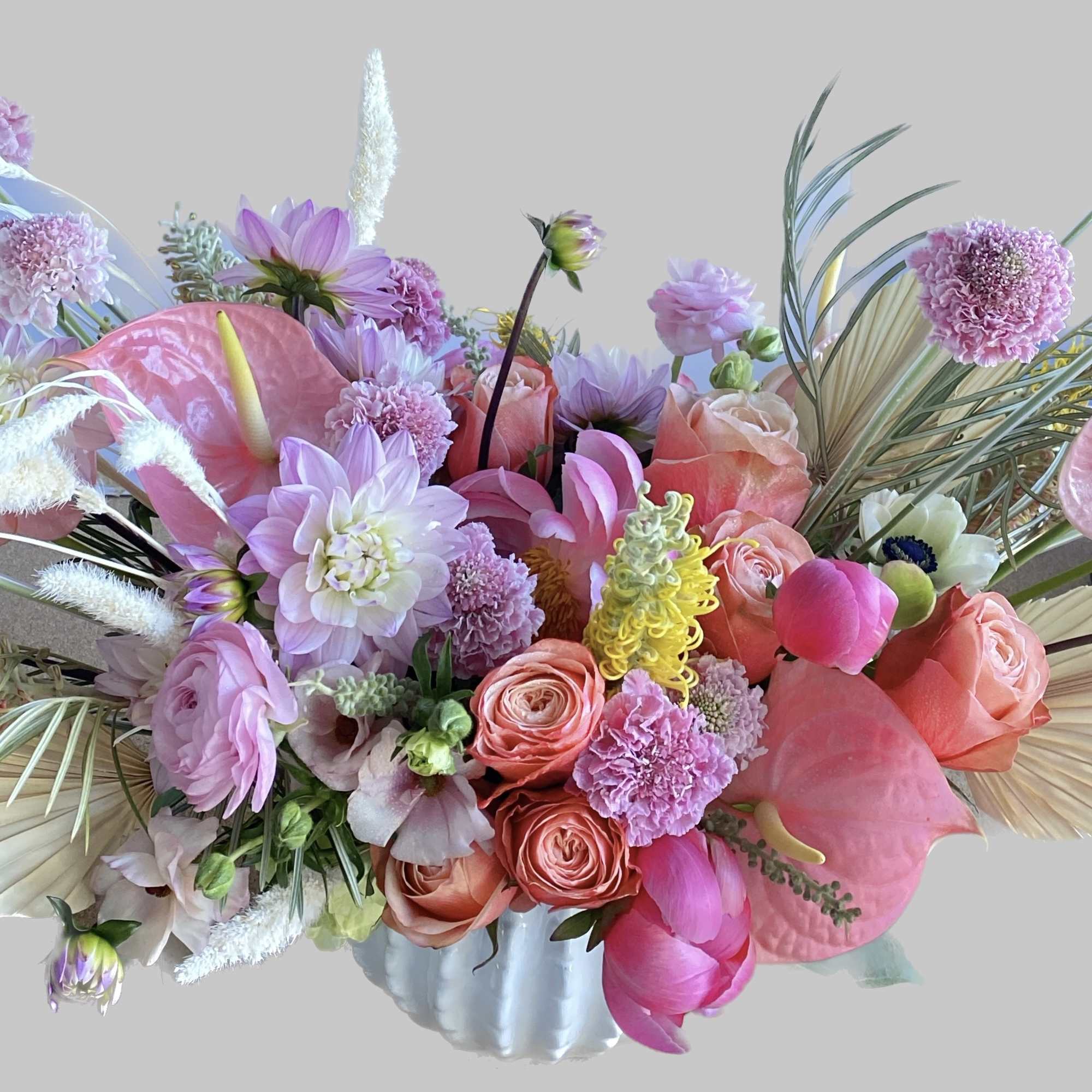 Pink and Peachy colored arrangement. An stunning antique design. Has Dahlias, Ranunculus