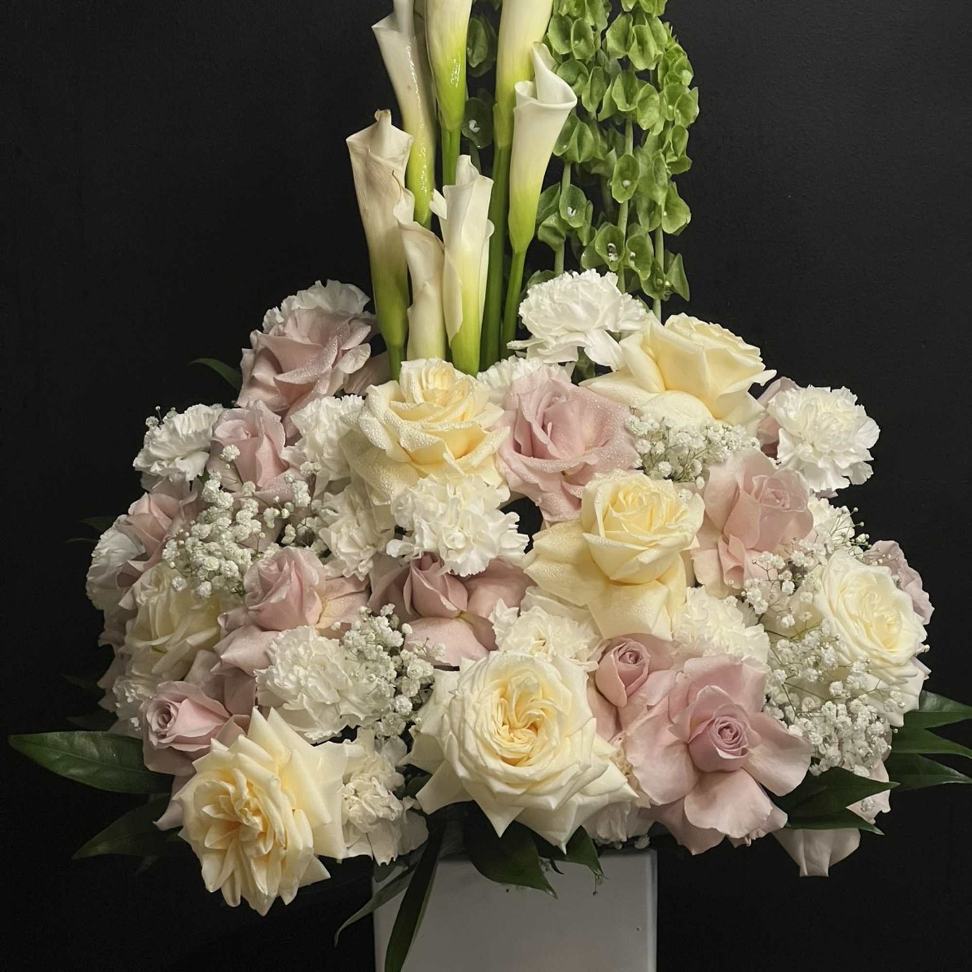 White Callas, Roses, baby breath , mini carnation, Foliage and square ceramic