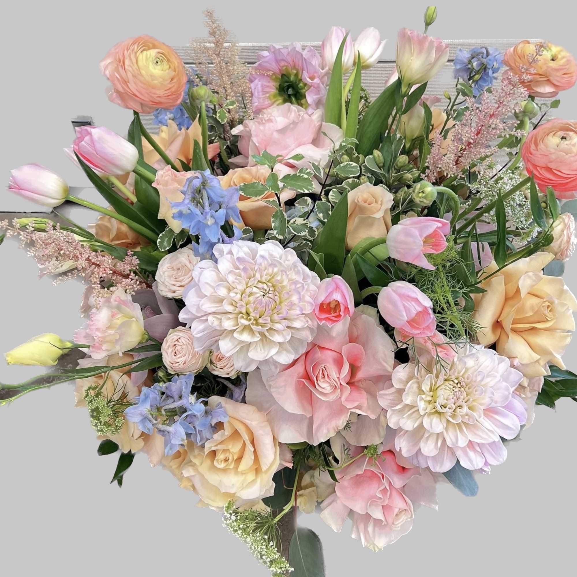 Mixed seasonal fresh blooms with blush roses and greenery 
Send this arrangement