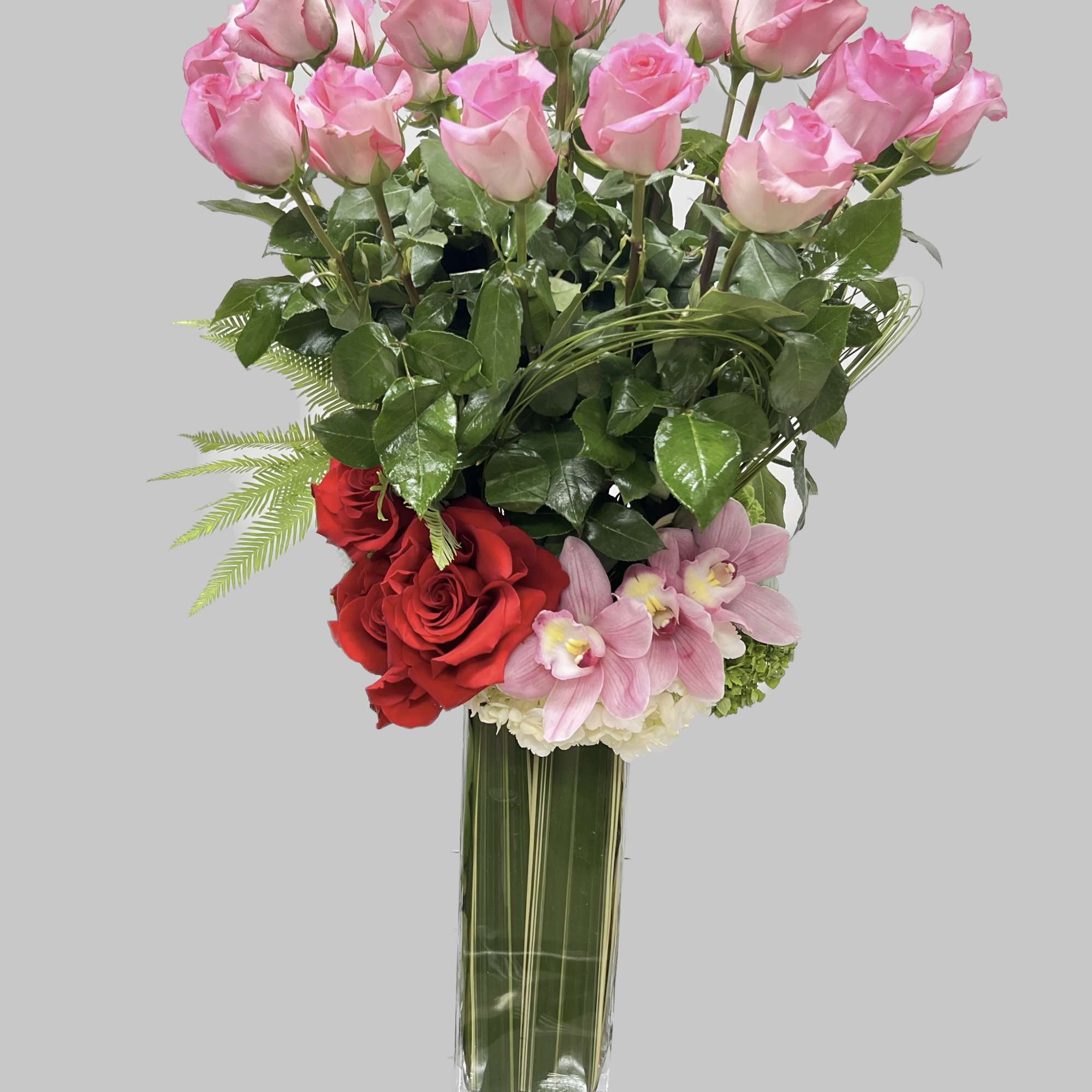 A charming bouquet of a  fresh and fragrant pink roses, adorned