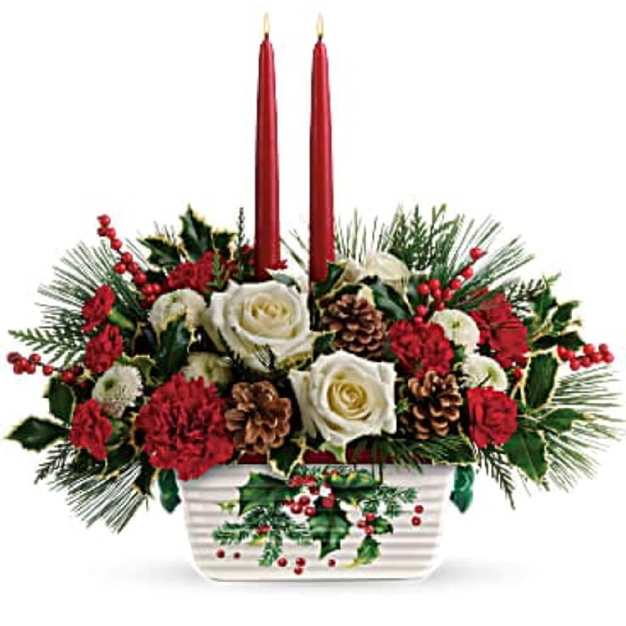 The holiday table shines with this festive centerpiece of roses and winter The holiday table shines with this festive centerpiece of roses and winter