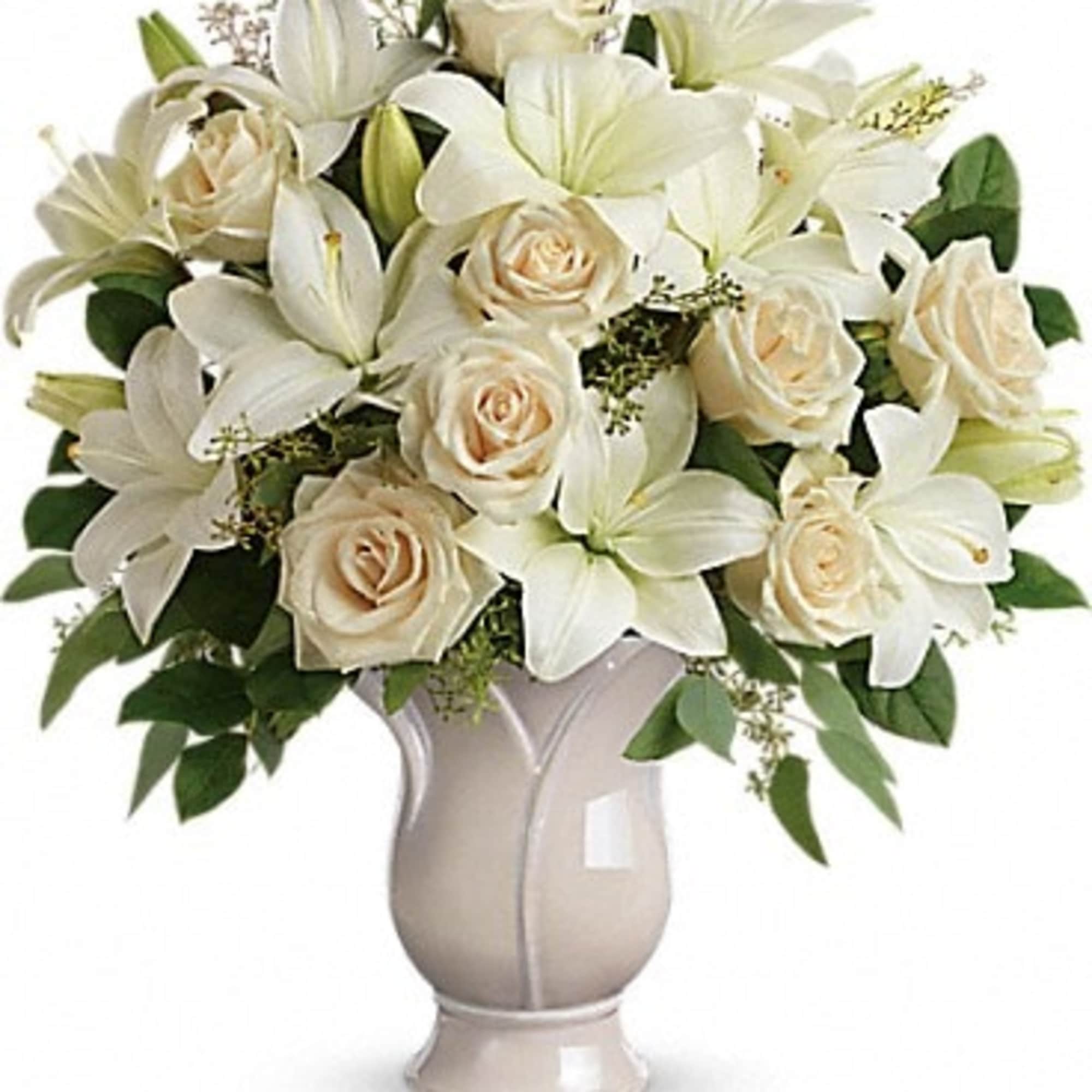 Celebrate a wondrous life with this timeless tribute of pure white lilies