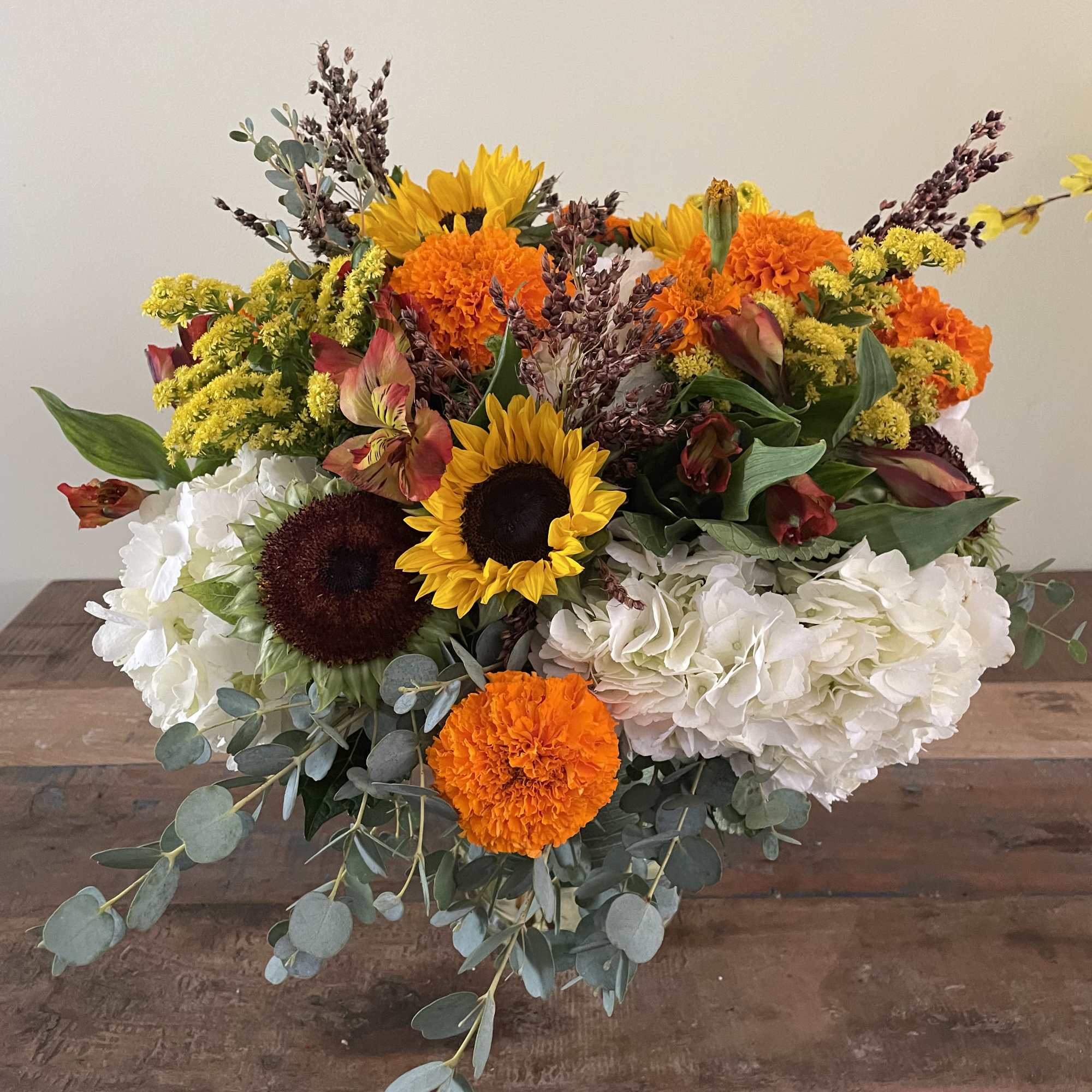 Hydrangea, sunflowers, marigolds, orange alstromeria sure to brighten anyone’s day! Hydrangea, sunflowers, marigolds, orange alstromeria sure to brighten anyone’s day!
