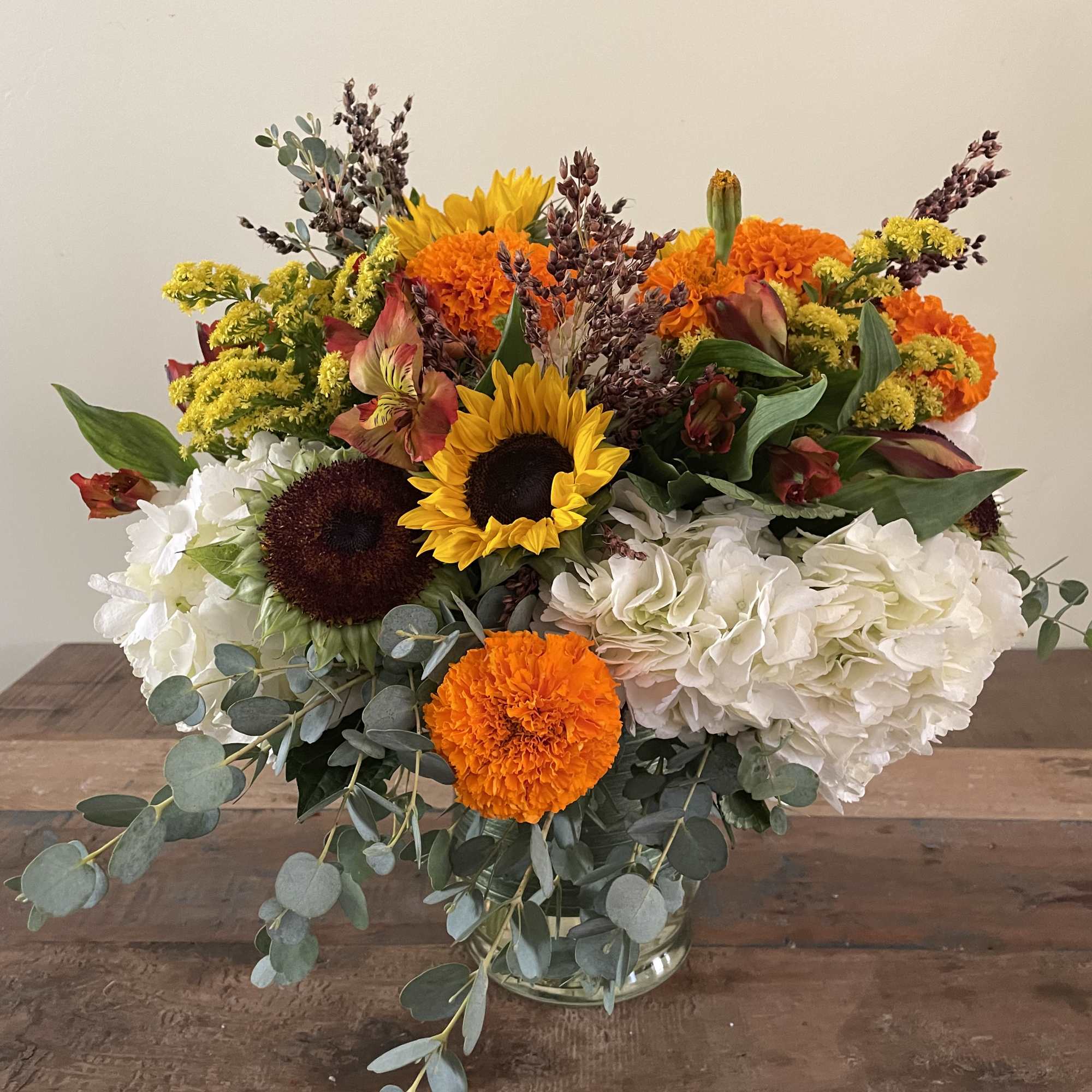 Hydrangea, sunflowers, marigolds, orange alstromeria sure to brighten anyone’s day! Hydrangea, sunflowers, marigolds, orange alstromeria sure to brighten anyone’s day!
