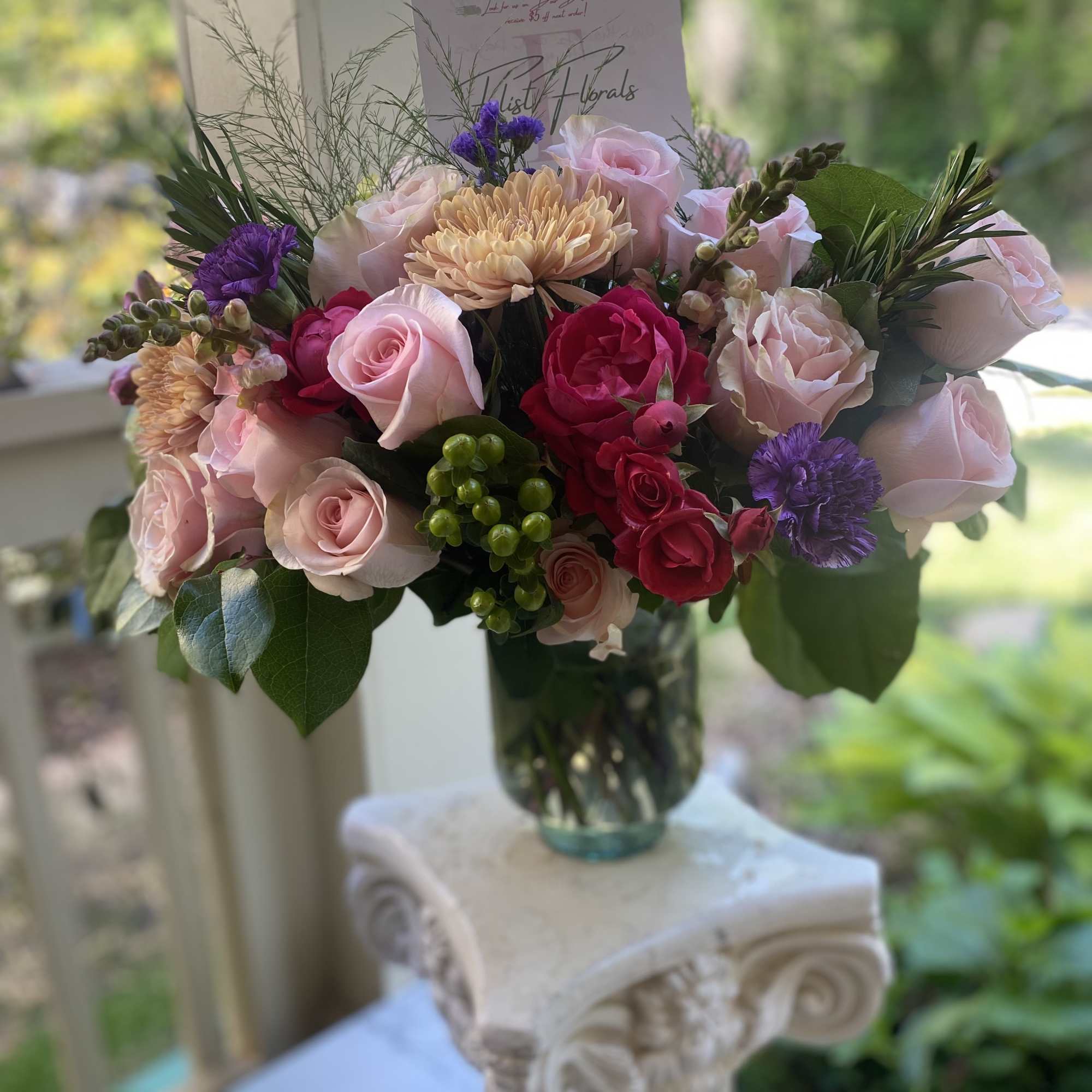 A luscious combination of roses Mums and seasonal fillers for the classic A luscious combination of roses Mums and seasonal fillers for the classic