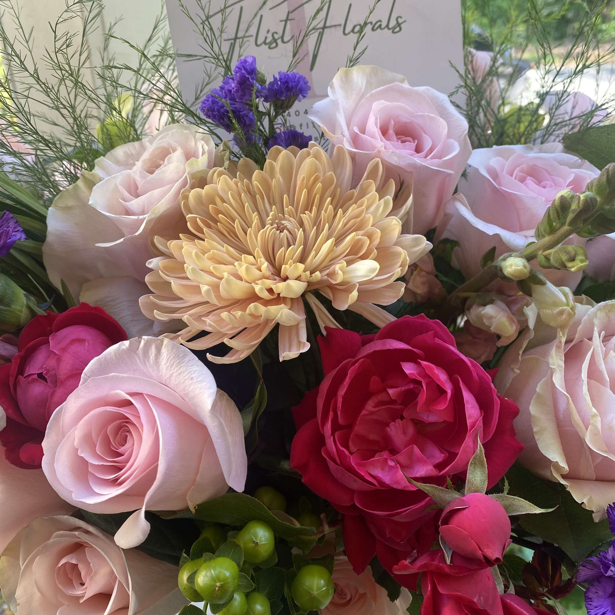 A luscious combination of roses Mums and seasonal fillers for the classic A luscious combination of roses Mums and seasonal fillers for the classic