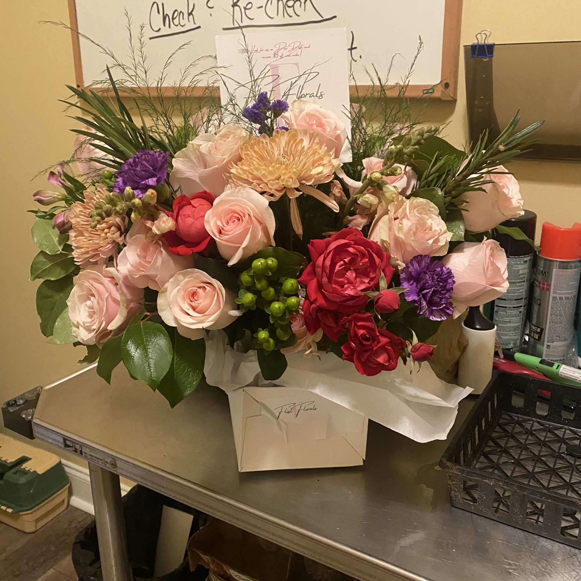 A luscious combination of roses Mums and seasonal fillers for the classic A luscious combination of roses Mums and seasonal fillers for the classic
