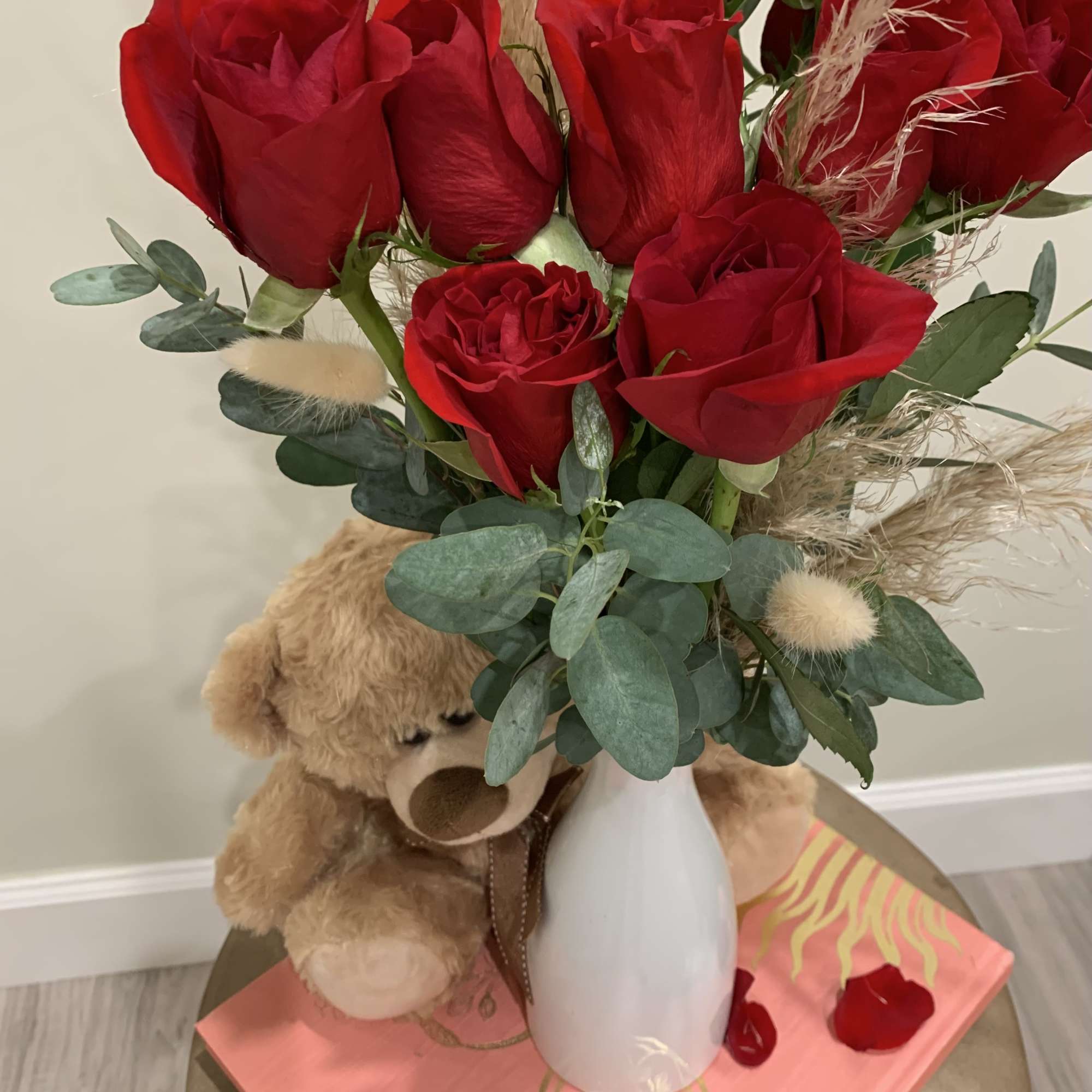 One dozen of red roses with a puffy friend and dry flowers