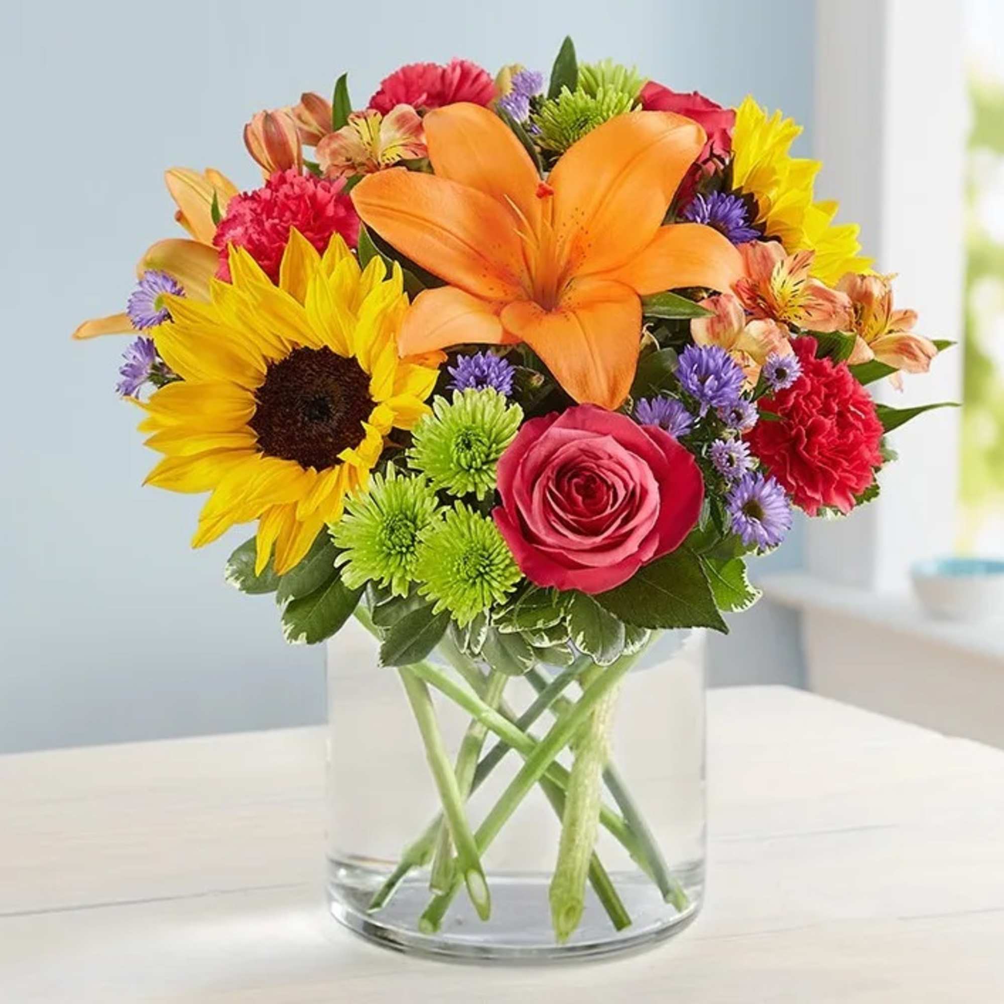 Like a warm embrace, our vibrant bouquet delivers your sentiments to someone Like a warm embrace, our vibrant bouquet delivers your sentiments to someone