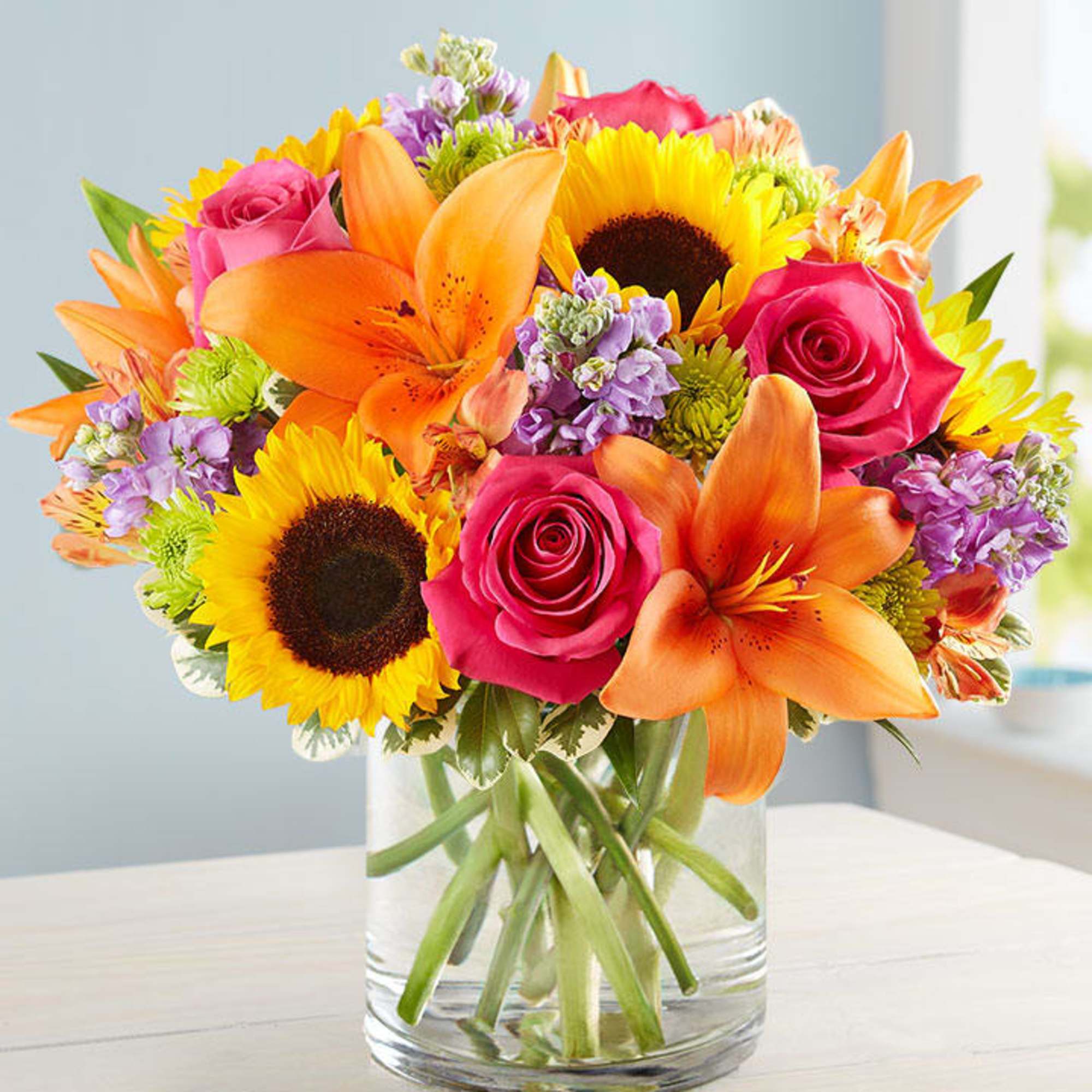 Like a warm embrace, our vibrant bouquet delivers your sentiments to someone Like a warm embrace, our vibrant bouquet delivers your sentiments to someone