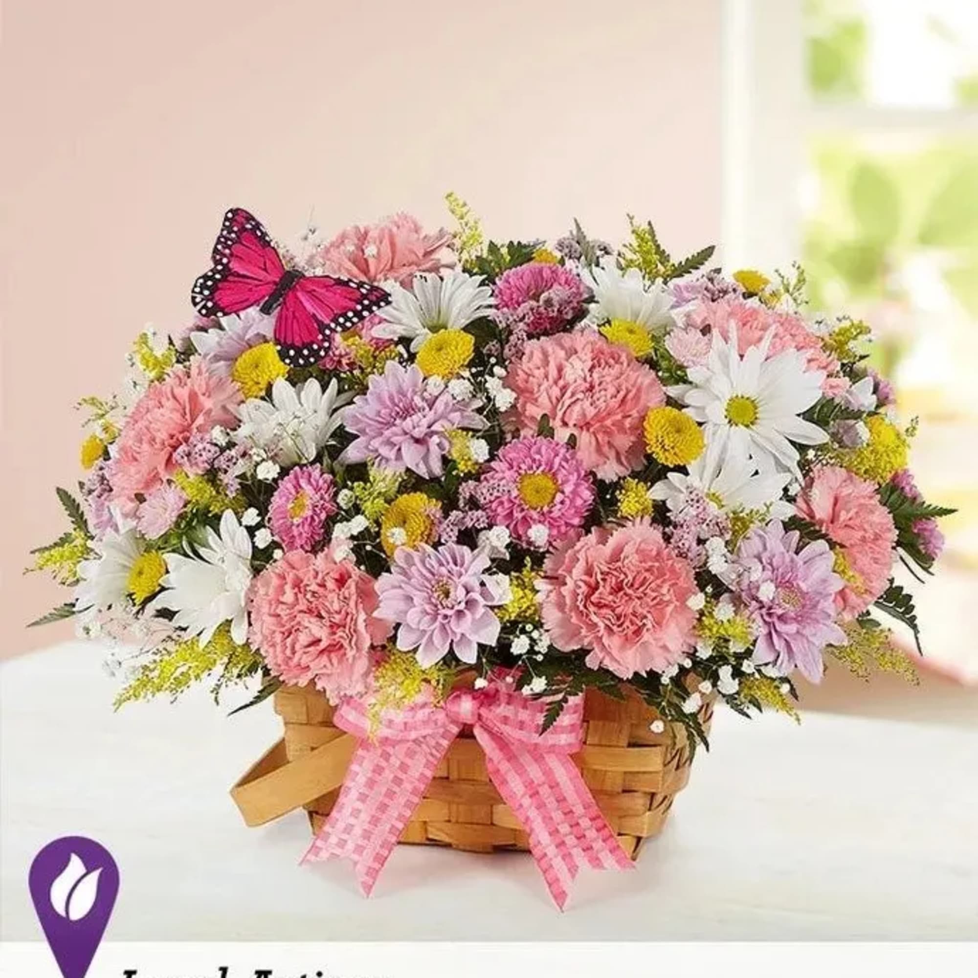 Our charming basket of blooms is an easy, go-to gift for any