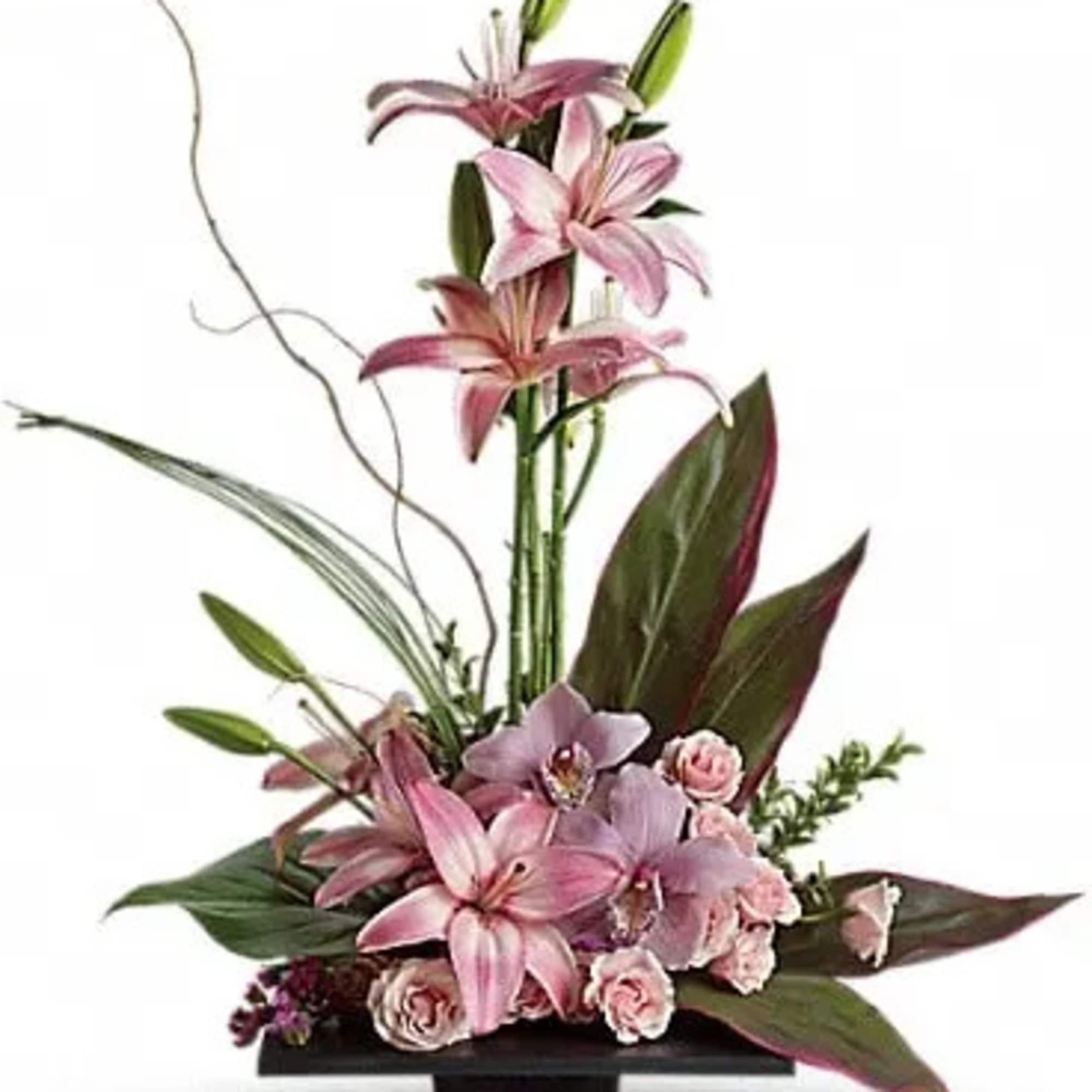 This towering topiary of asiatic lilies, orchids and roses - artistically arranged