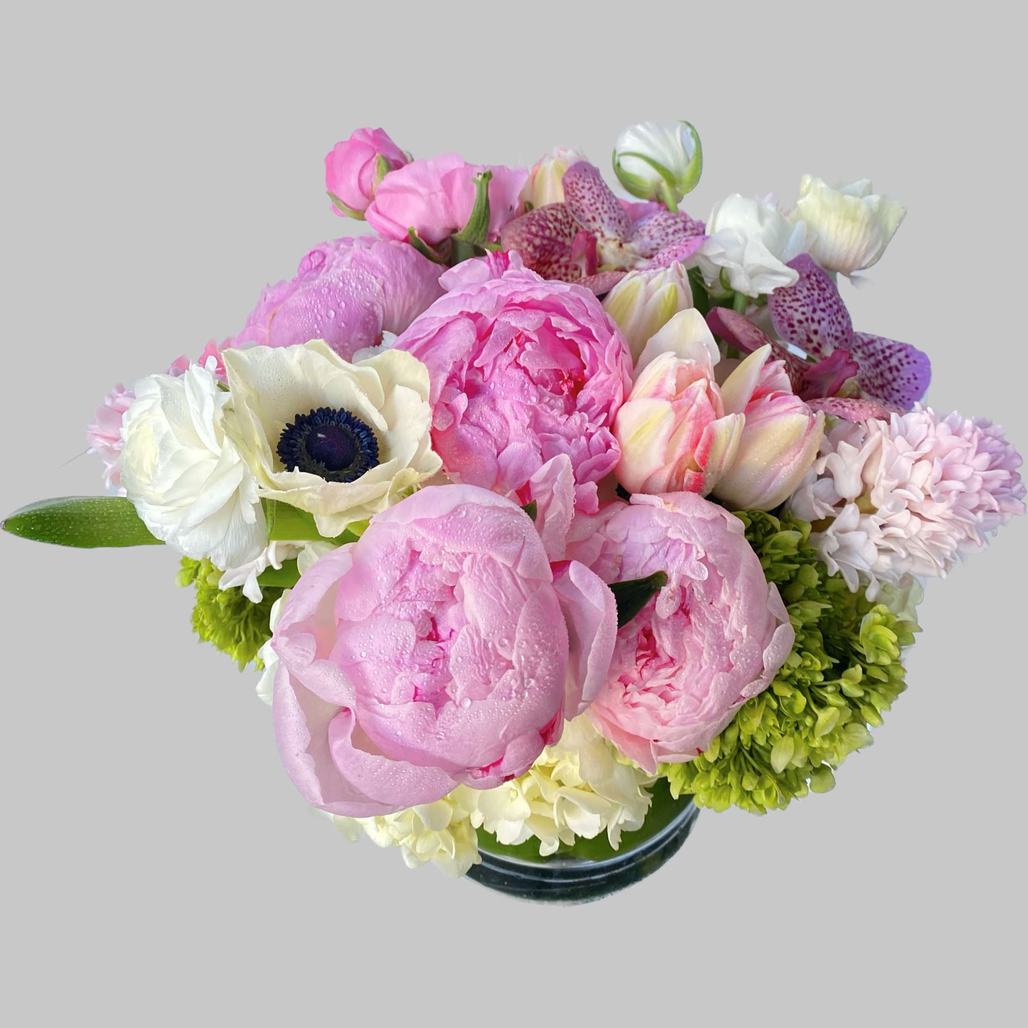 Pretty pink peonies with orchids and ranunculus. Perfect for a day out