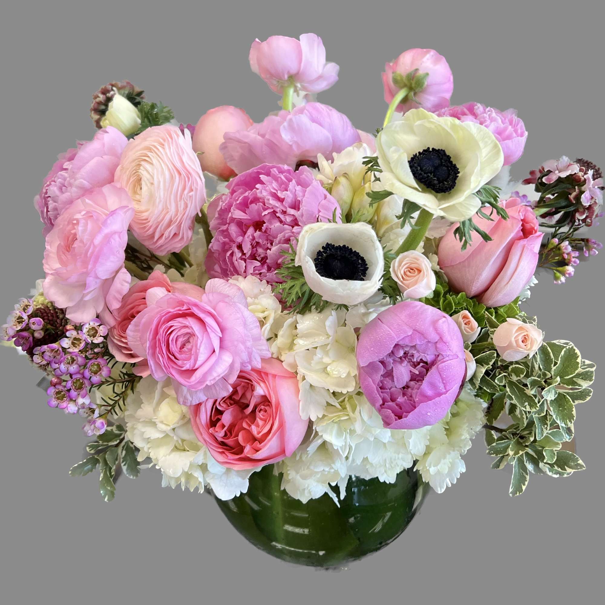 Pretty pink peonies with orchids and ranunculus. Perfect for a day out