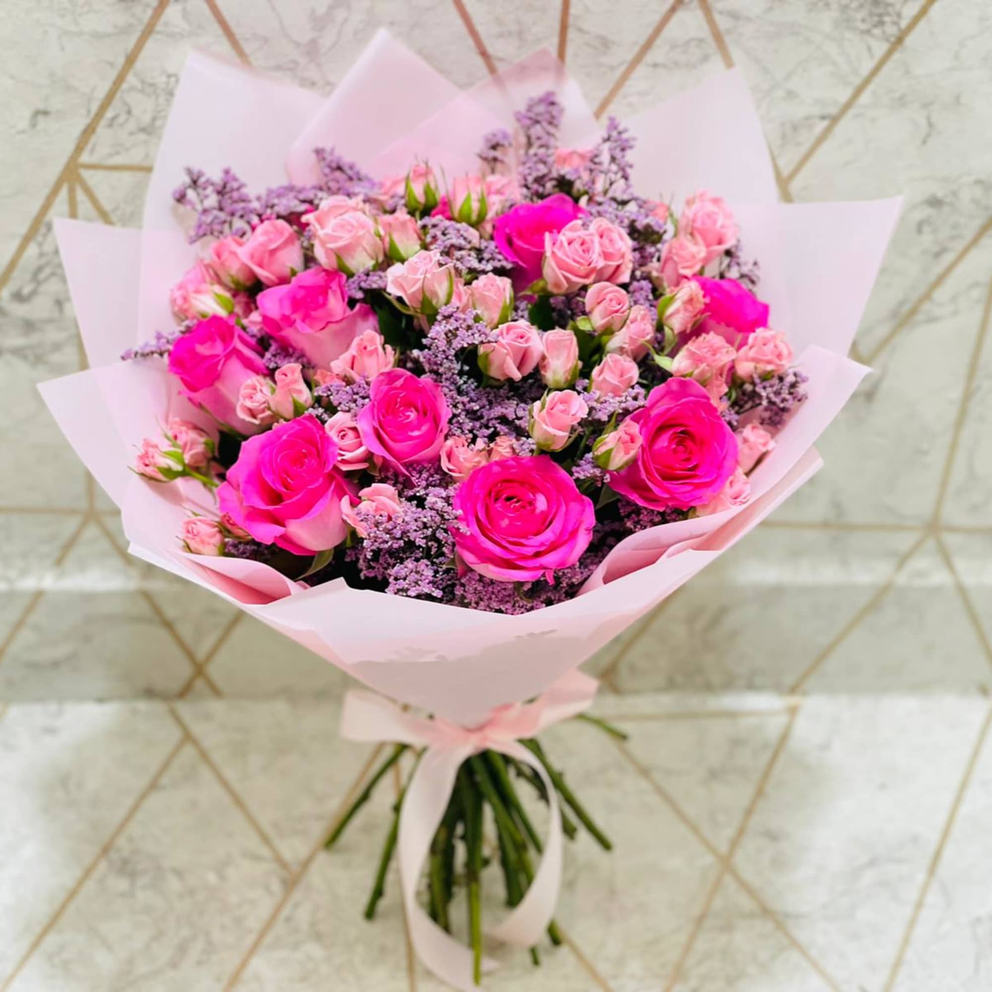 pink and purple mixed floweers beautifully put together as a bouquet. please