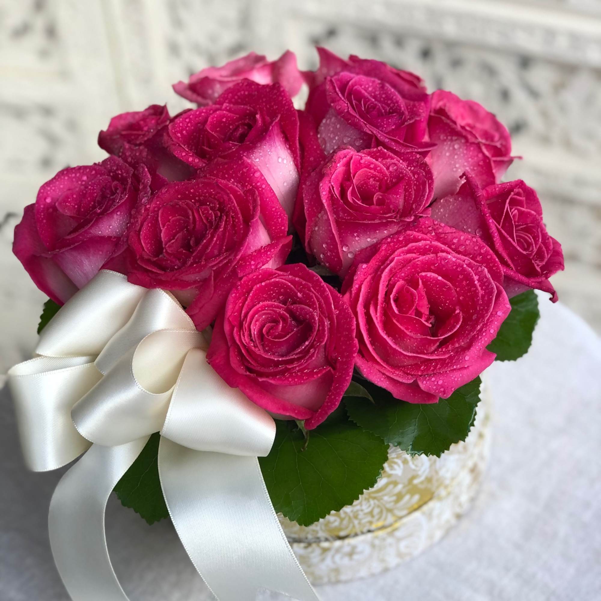 Gorgeous pink roses presented in a gold and white box and simply