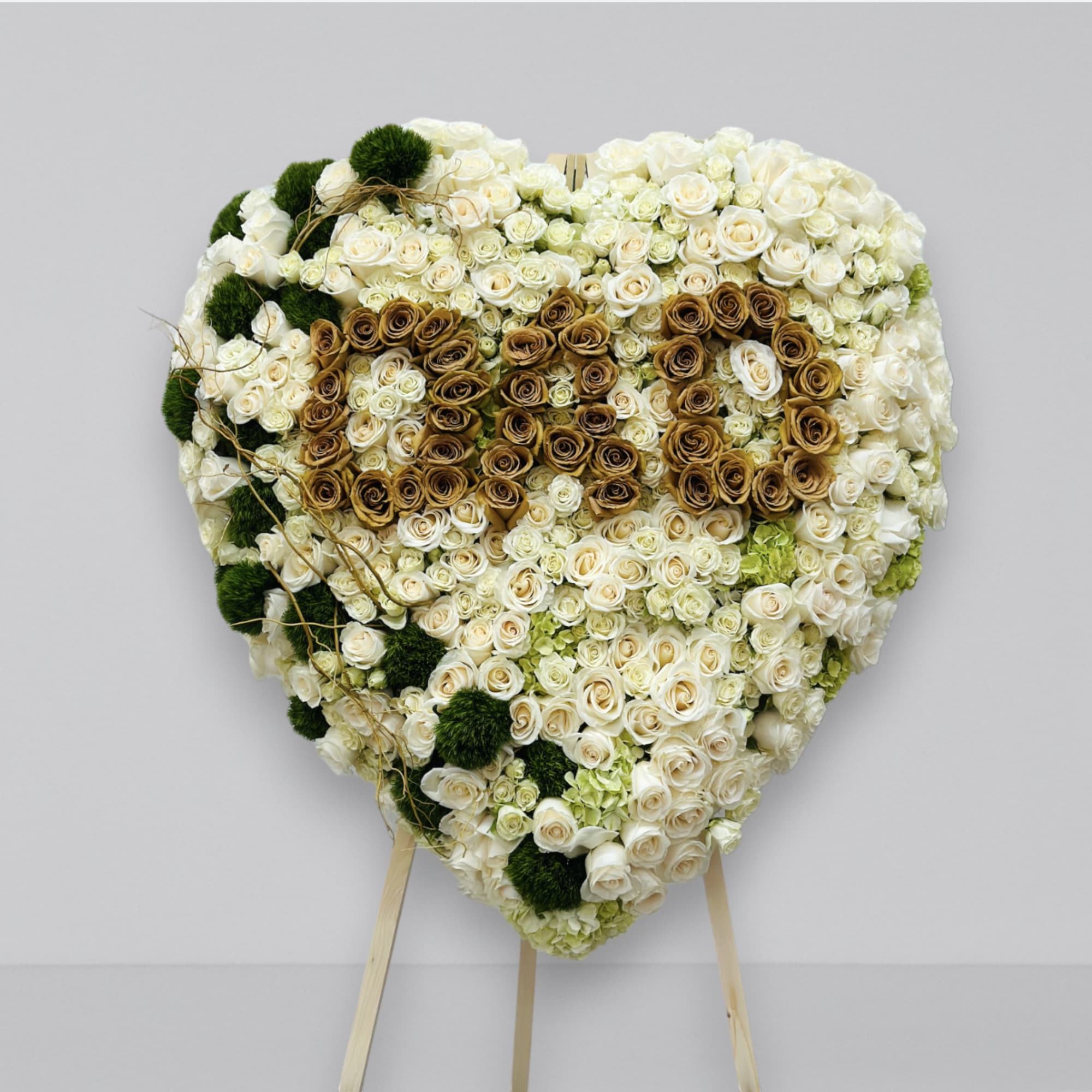 A beautiful full heart spelling out DAD. Filled with fresh florals, hydrangea